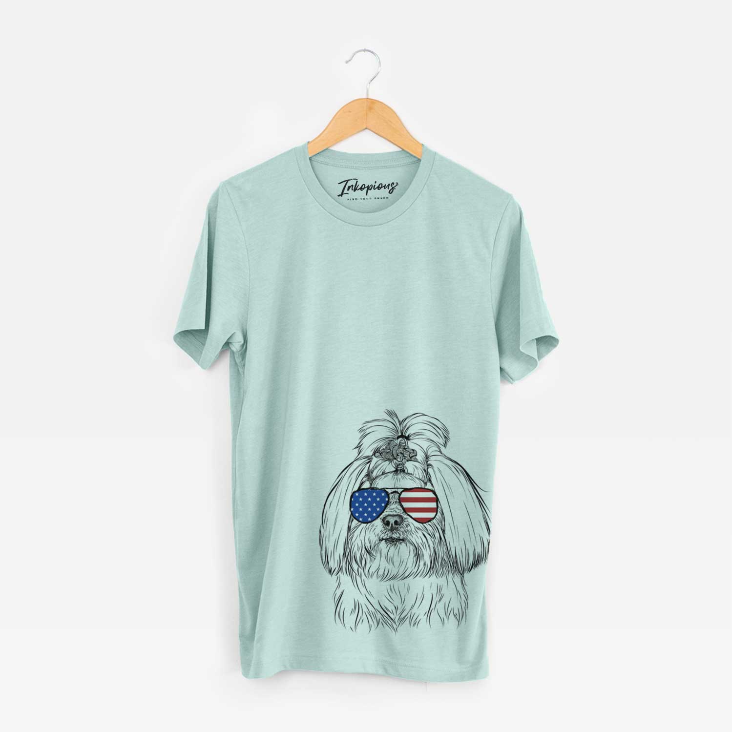 Hand-drawn sketch of Olga the Shih Tzu wearing American flag sunglasses on a Heather Sage Unisex crewneck