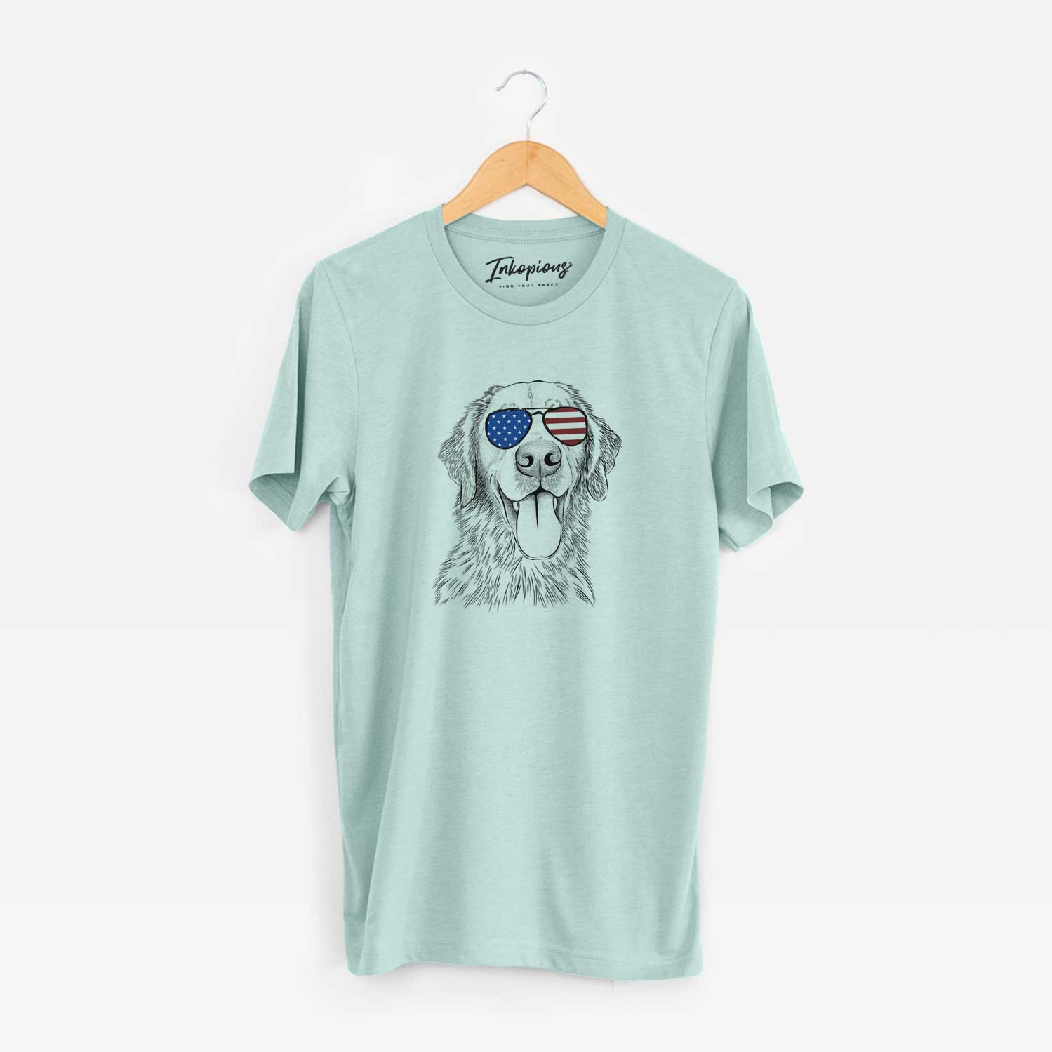 Hand-drawn sketch of Oliver Tredup the Golden Retriever wearing American flag sunglasses on a Heather Sage Unisex crewneck