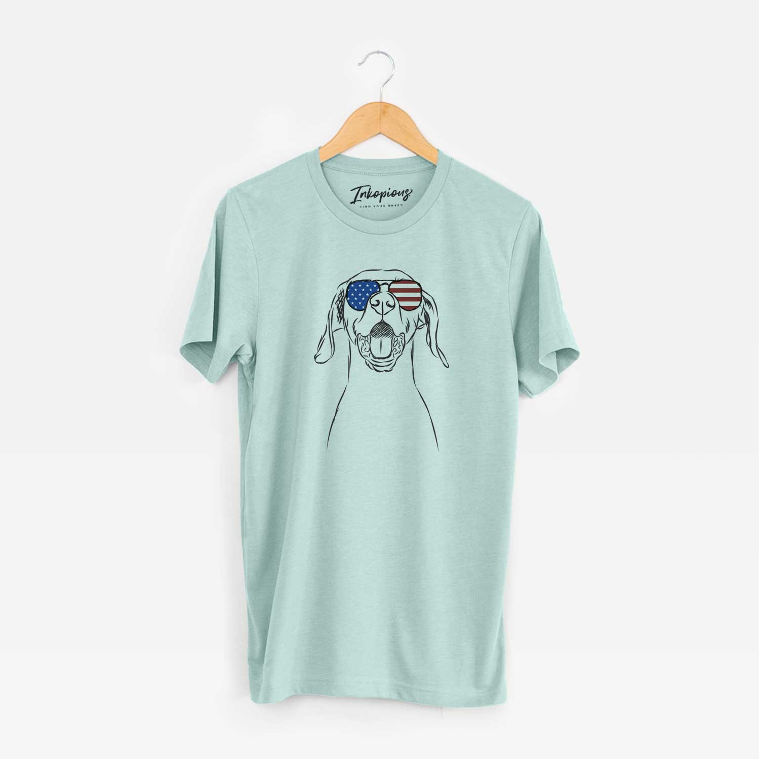 Hand-drawn sketch of Ollie the Vizsla wearing American flag sunglasses on a Heather Sage Unisex crewneck