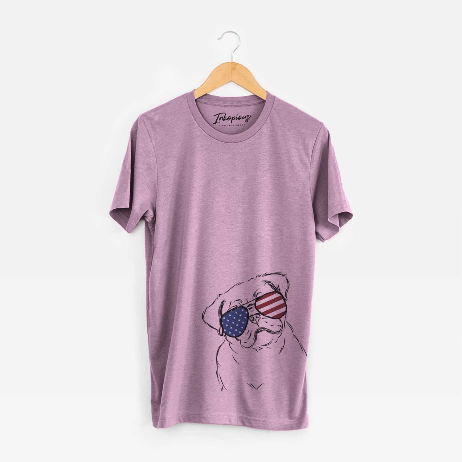 Hand-drawn sketch of Otis the Pug wearing American flag sunglasses on an Orchid Unisex crewneck