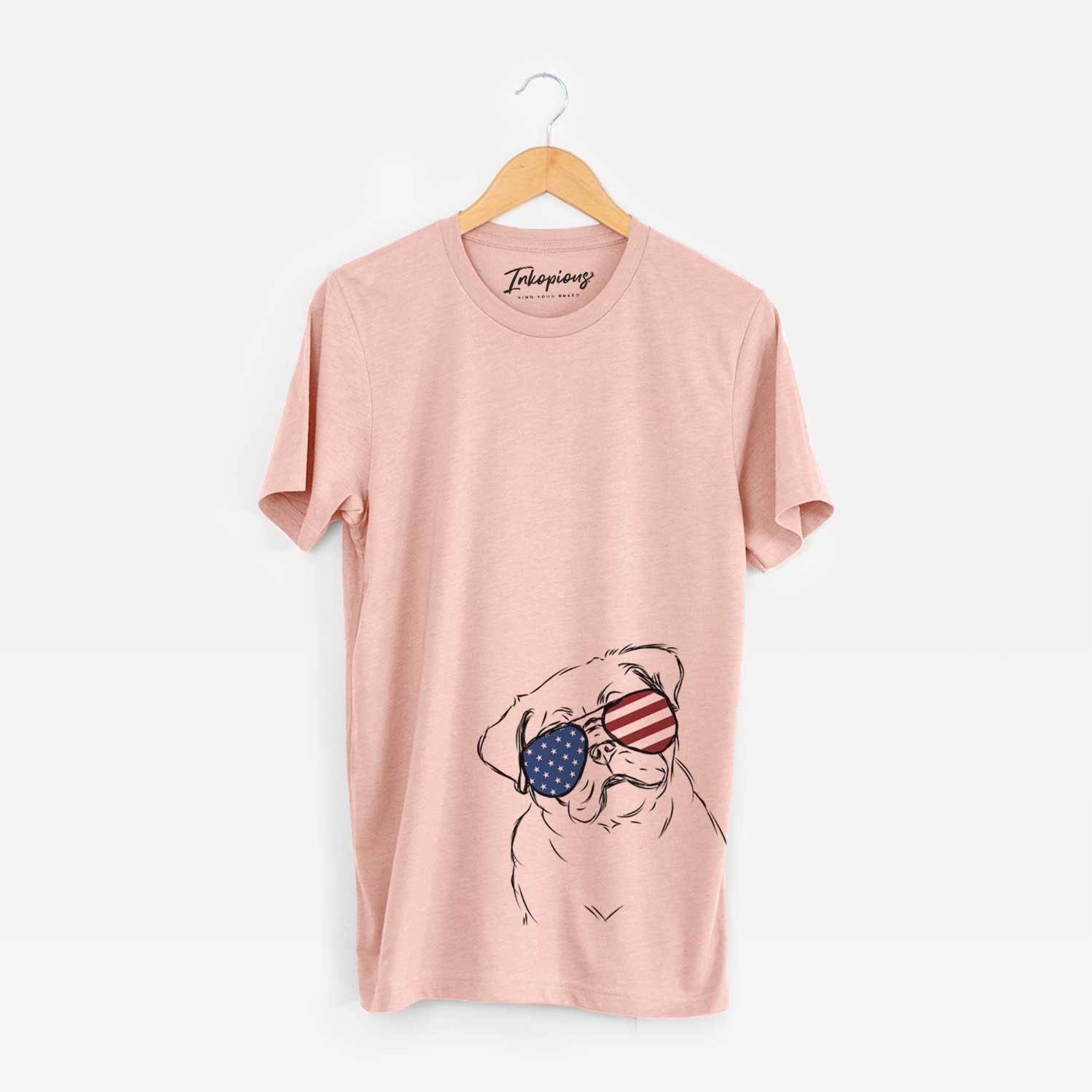 Hand-drawn sketch of Otis the Pug wearing American flag sunglasses on a Peach Unisex crewneck