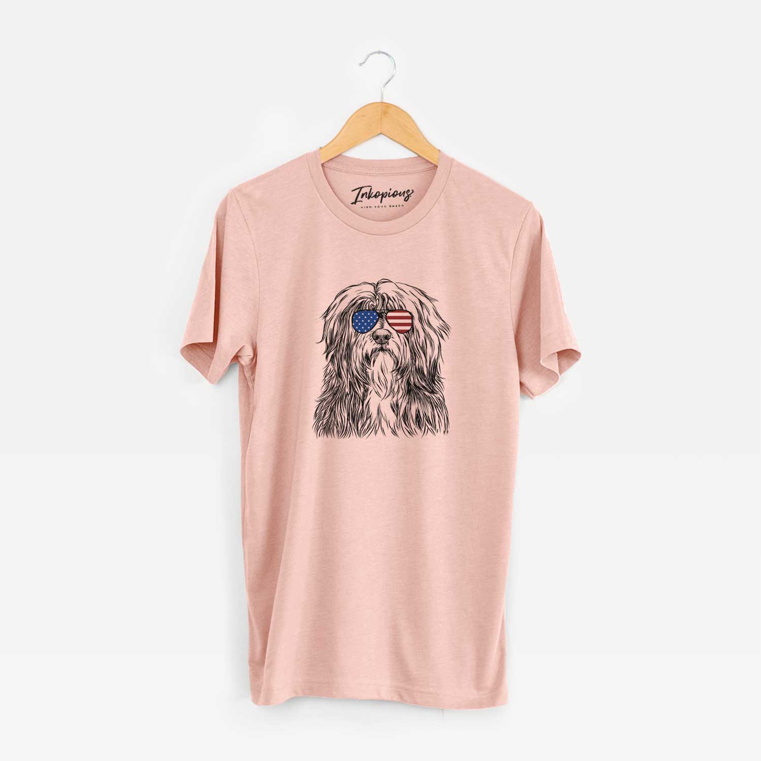 Hand-drawn sketch of Otto the Polish Lowland Sheepdog wearing American flag sunglasses on a Peach Unisex crewneck