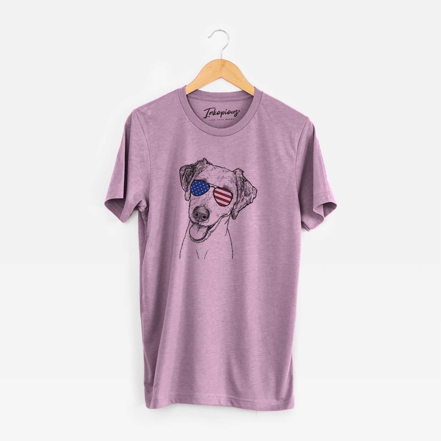 Hand-drawn sketch of Palm Palm the Aussiedoodle wearing American flag sunglasses on an Orchid Unisex crewneck