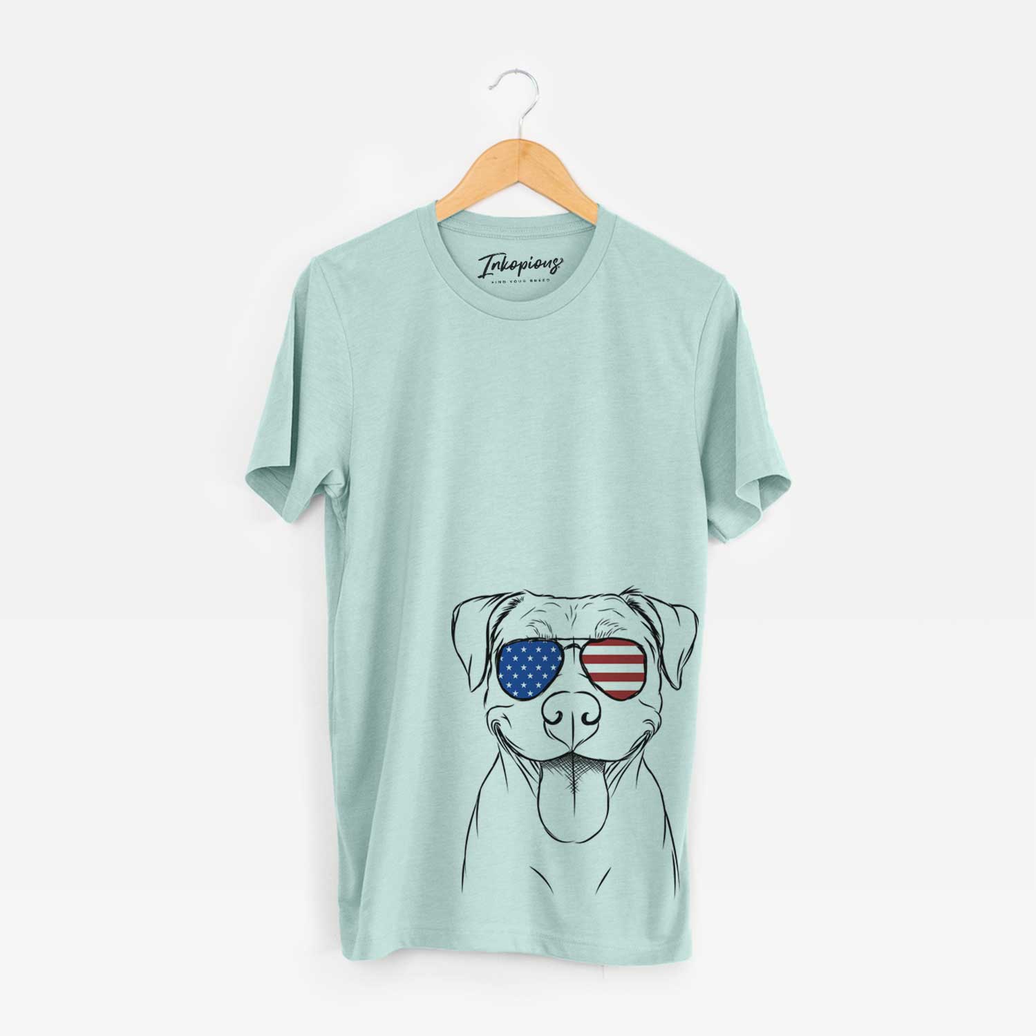 Hand-drawn sketch of Parker the Pitbull wearing American flag sunglasses on a Heather Sage Unisex crewneck