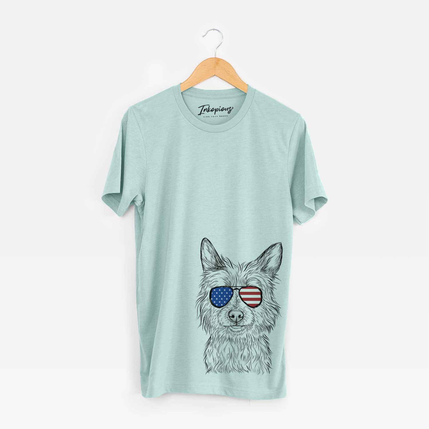 Hand-drawn sketch of Paulo the Portuguese Podengo wearing American flag sunglasses on a Heather Sage Unisex crewneck