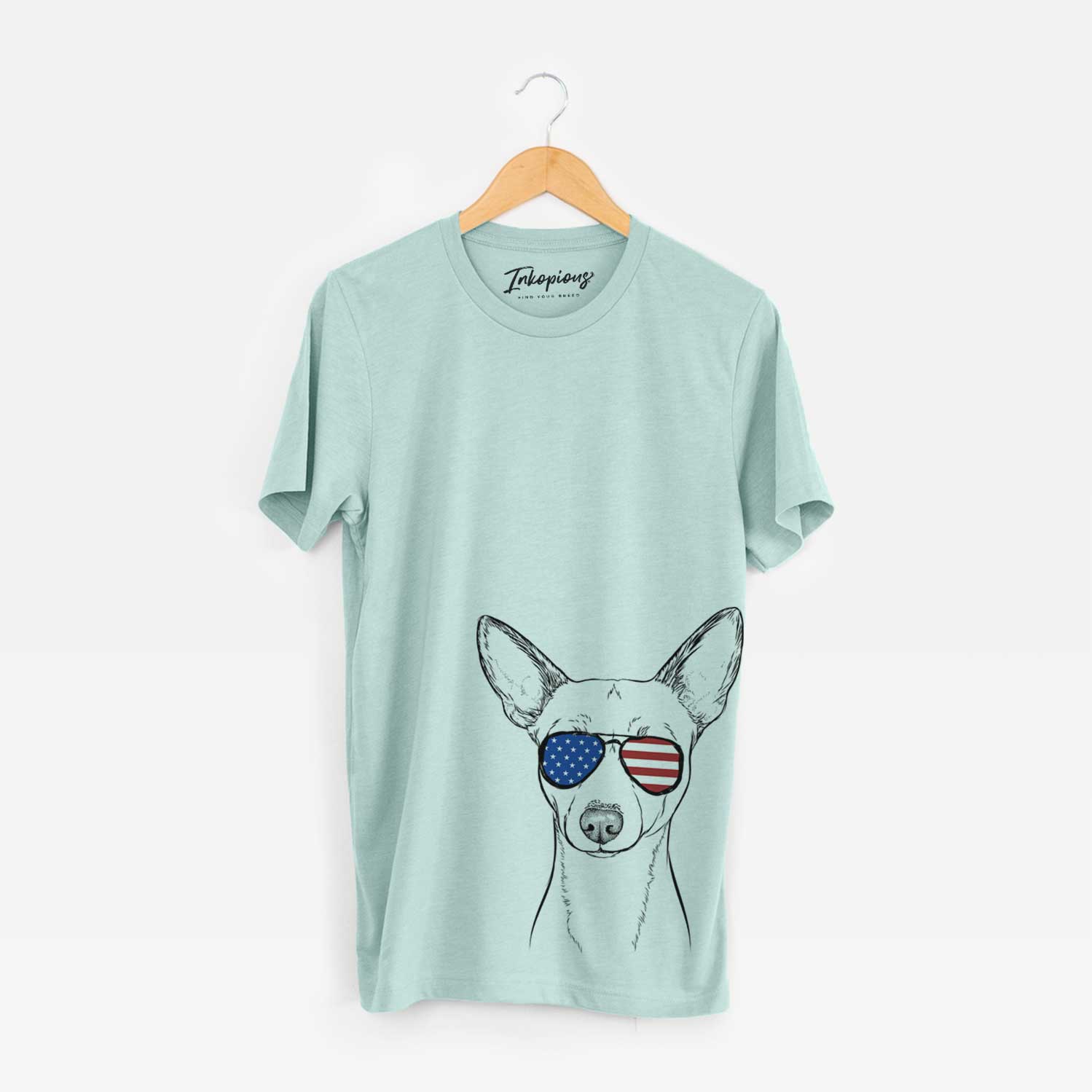 Hand-drawn sketch of Perry the Portuguese Podengo wearing American flag sunglasses on a Heather Sage Unisex crewneck