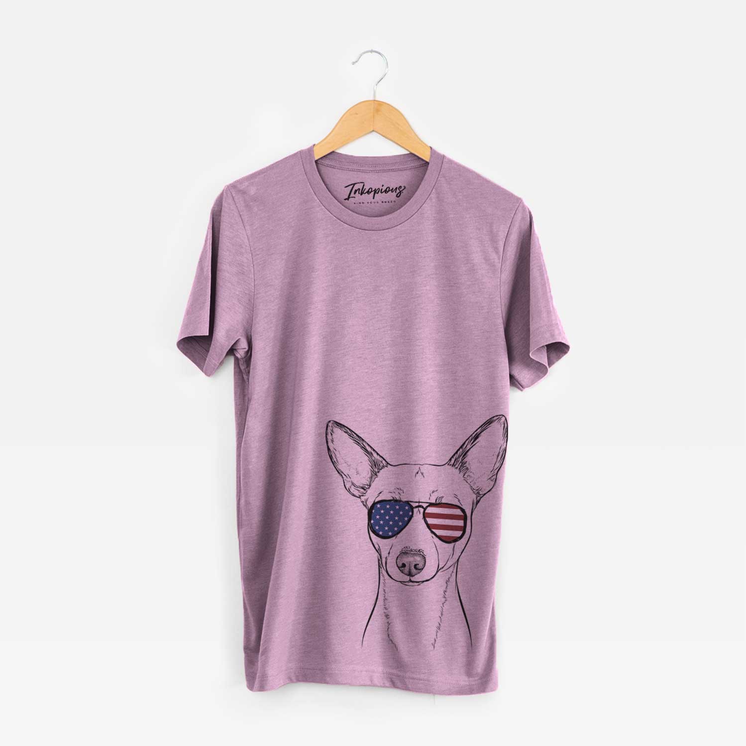 Hand-drawn sketch of Perry the Portuguese Podengo wearing American flag sunglasses on an Orchid Unisex crewneck