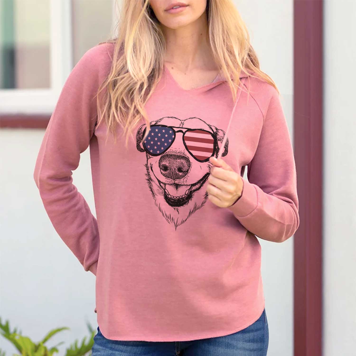 Hand-drawn sketch of Petrah the Staffy Mix wearing American flag sunglasses on a Dusty Rose Cali Wave Hooded Sweatshirt, lifestyle photo