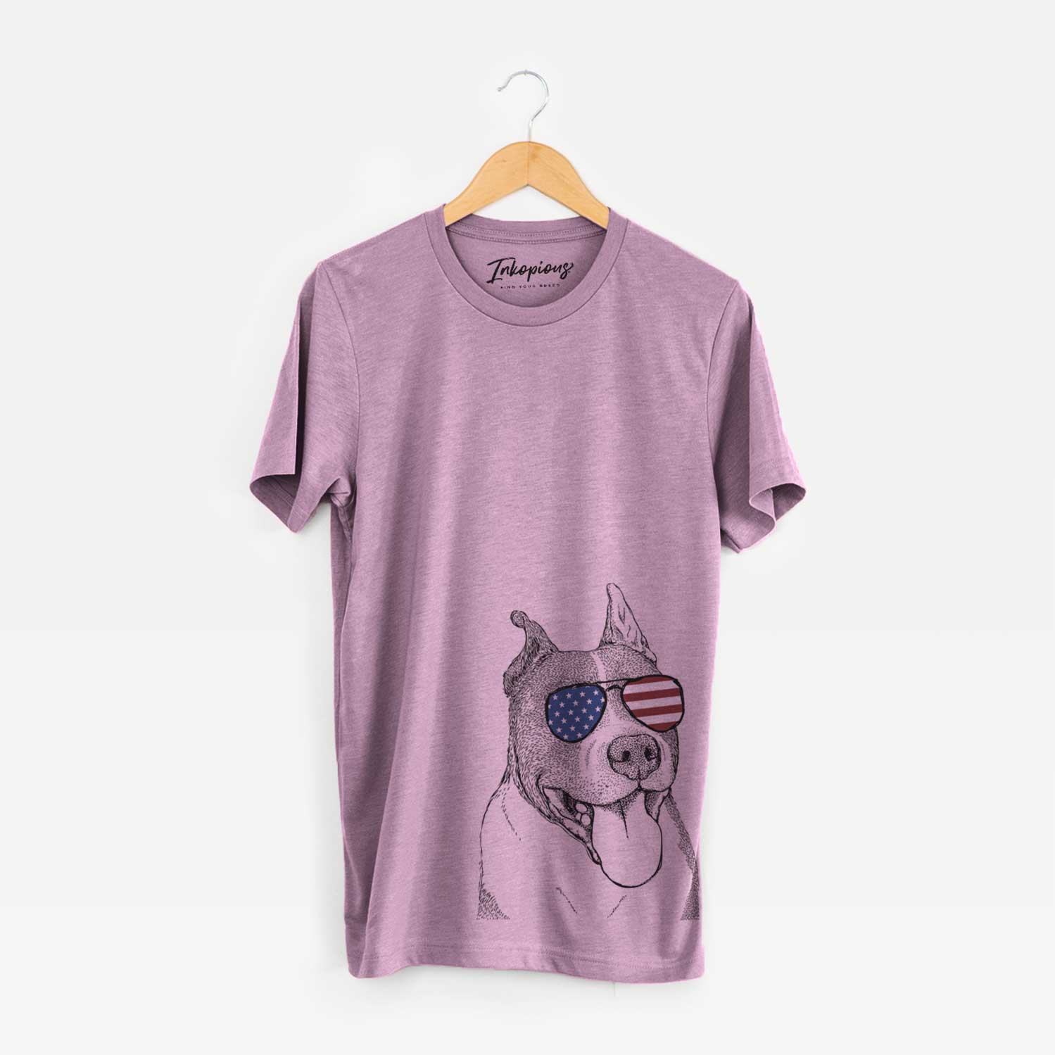Hand-drawn sketch of Piggy the American Staffordshire Terrier wearing American flag sunglasses on an Orchid Unisex crewneck