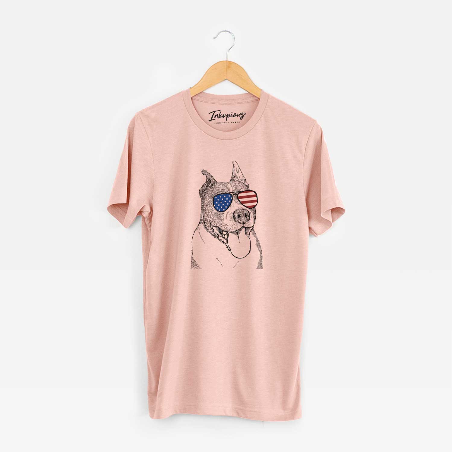 Hand-drawn sketch of Piggy the American Staffordshire Terrier wearing American flag sunglasses on a Peach Unisex crewneck