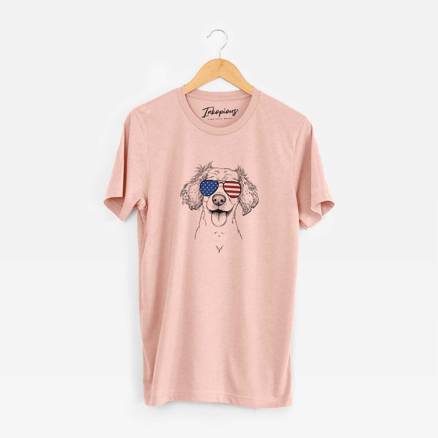 Hand-drawn sketch of Piglet the Dachshund Mix wearing American flag sunglasses on a Peach Unisex crewneck
