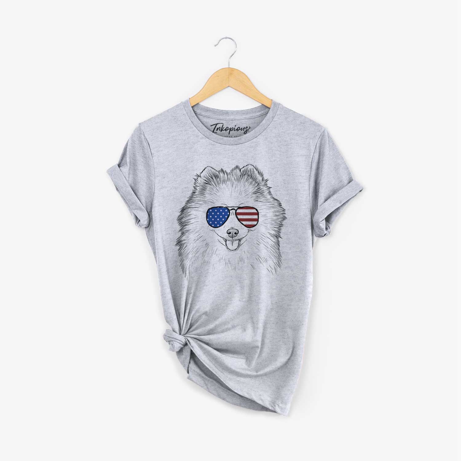 Hand-drawn sketch of Piper Jo the Pomeranian wearing American flag sunglasses on a Grey Unisex crewneck