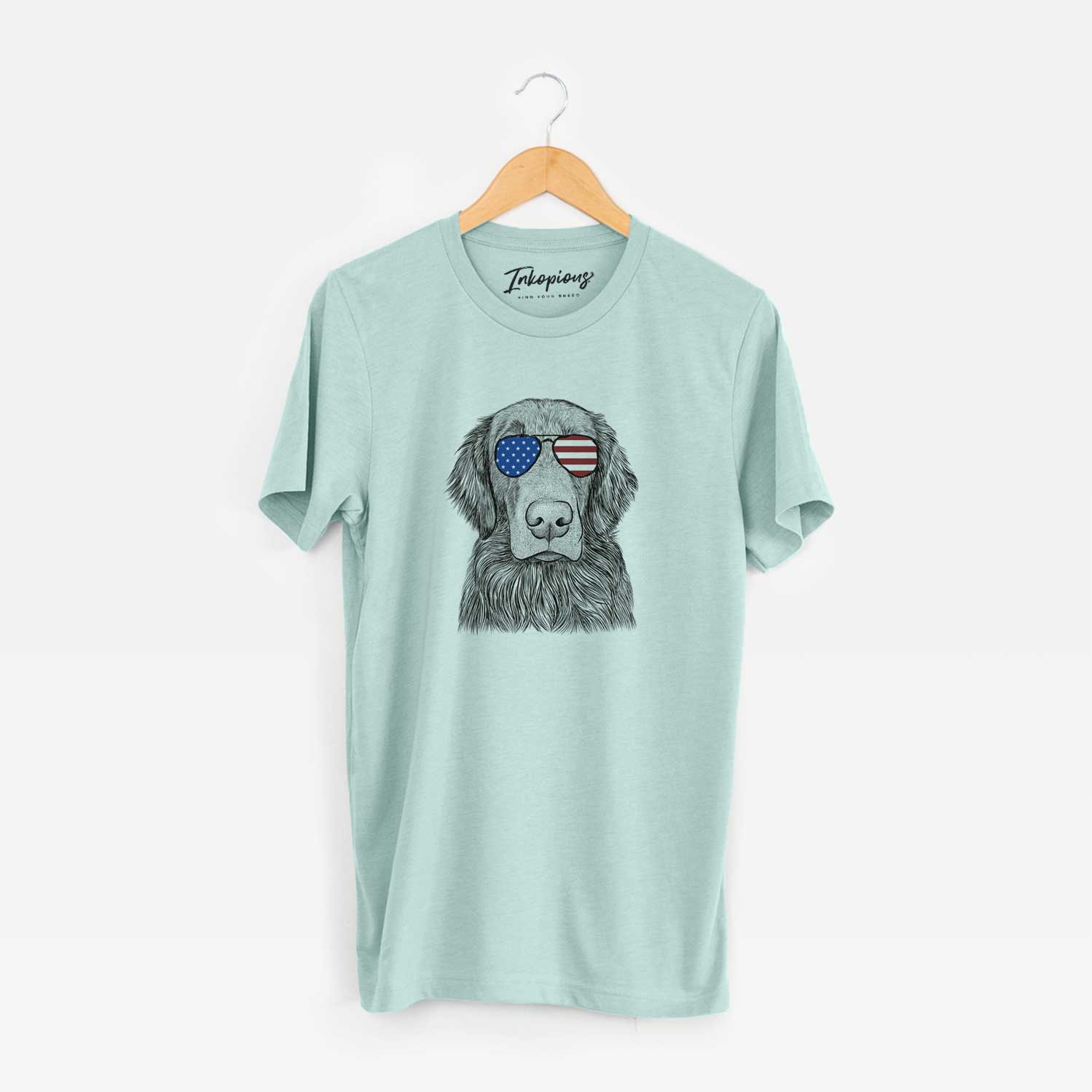 Hand-drawn sketch of Pippin the Flat Coated Retriever wearing American flag sunglasses on a Heather Sage Unisex crewneck