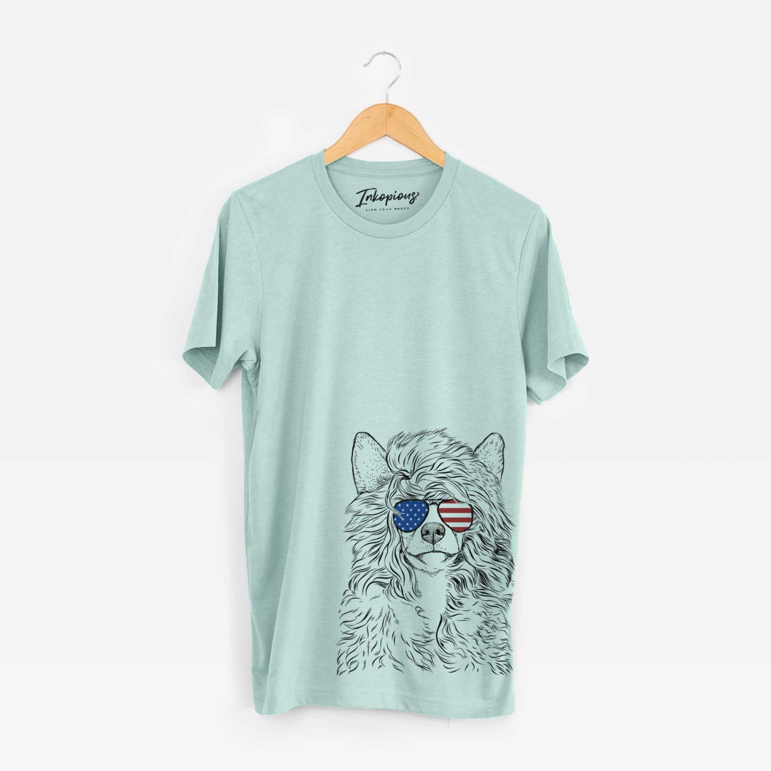 Hand-drawn sketch of Preston the Powderpuff Chinese Crested wearing American flag sunglasses on a Heather Sage Unisex crewneck