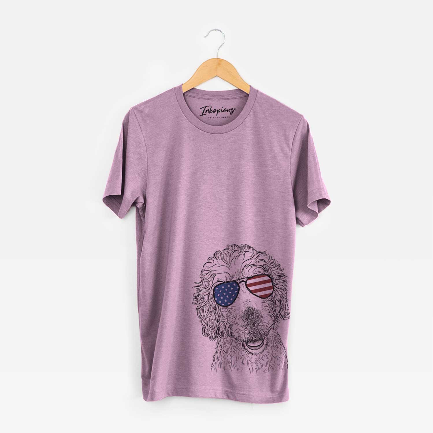 Hand-drawn sketch of Preston the Labradoodle wearing American flag sunglasses on an Orchid Unisex crewneck