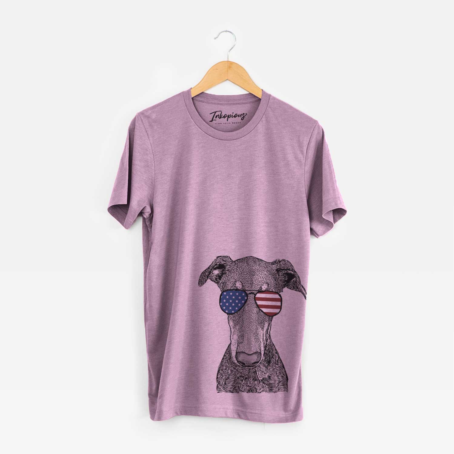 Hand-drawn sketch of Princess Fiona the Doberman Pinscher wearing American flag sunglasses on an Orchid Unisex crewneck