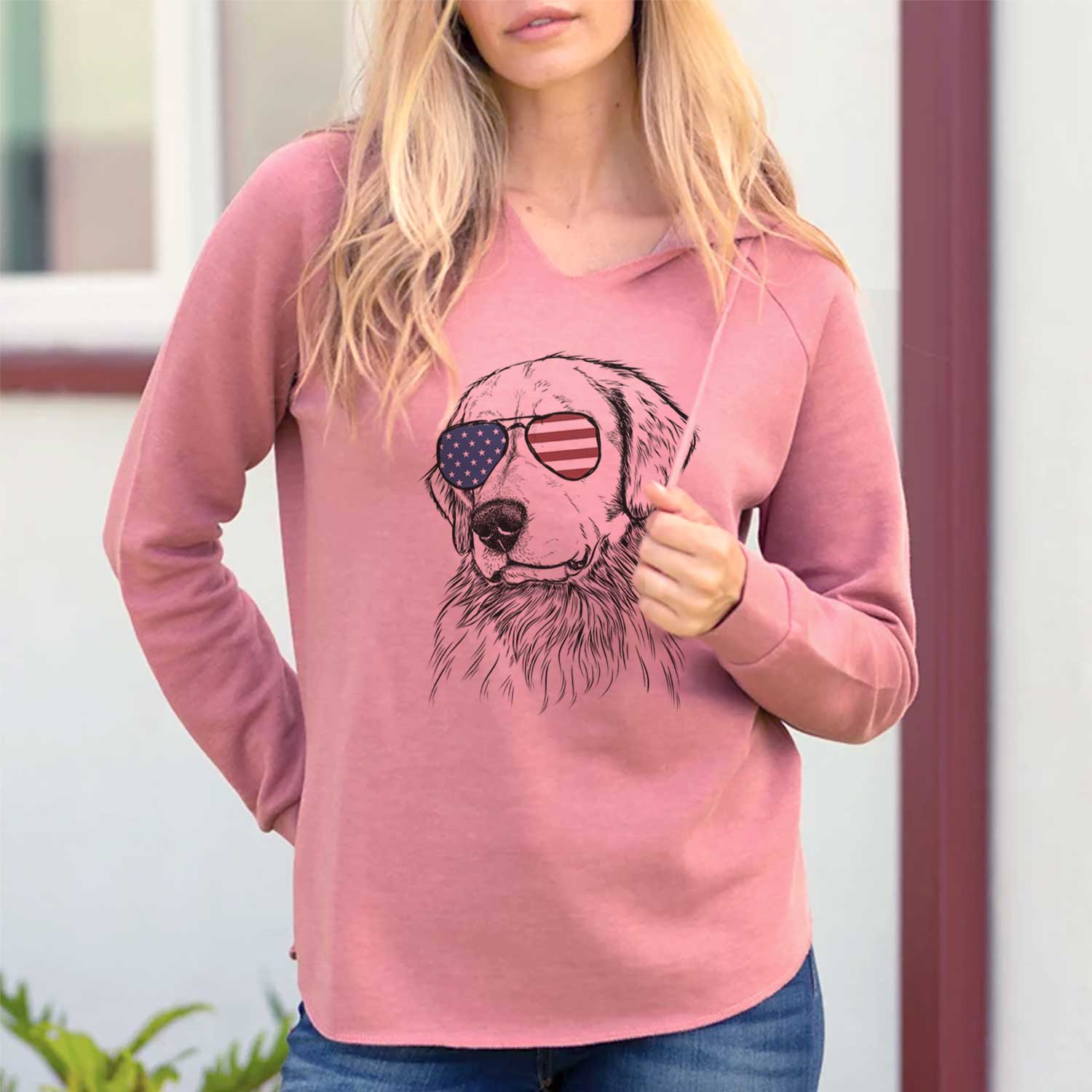 Hand-drawn sketch of Quinn the Golden Retriever wearing American flag sunglasses on a Dusty Rose Cali Wave Hooded Sweatshirt, lifestyle photo