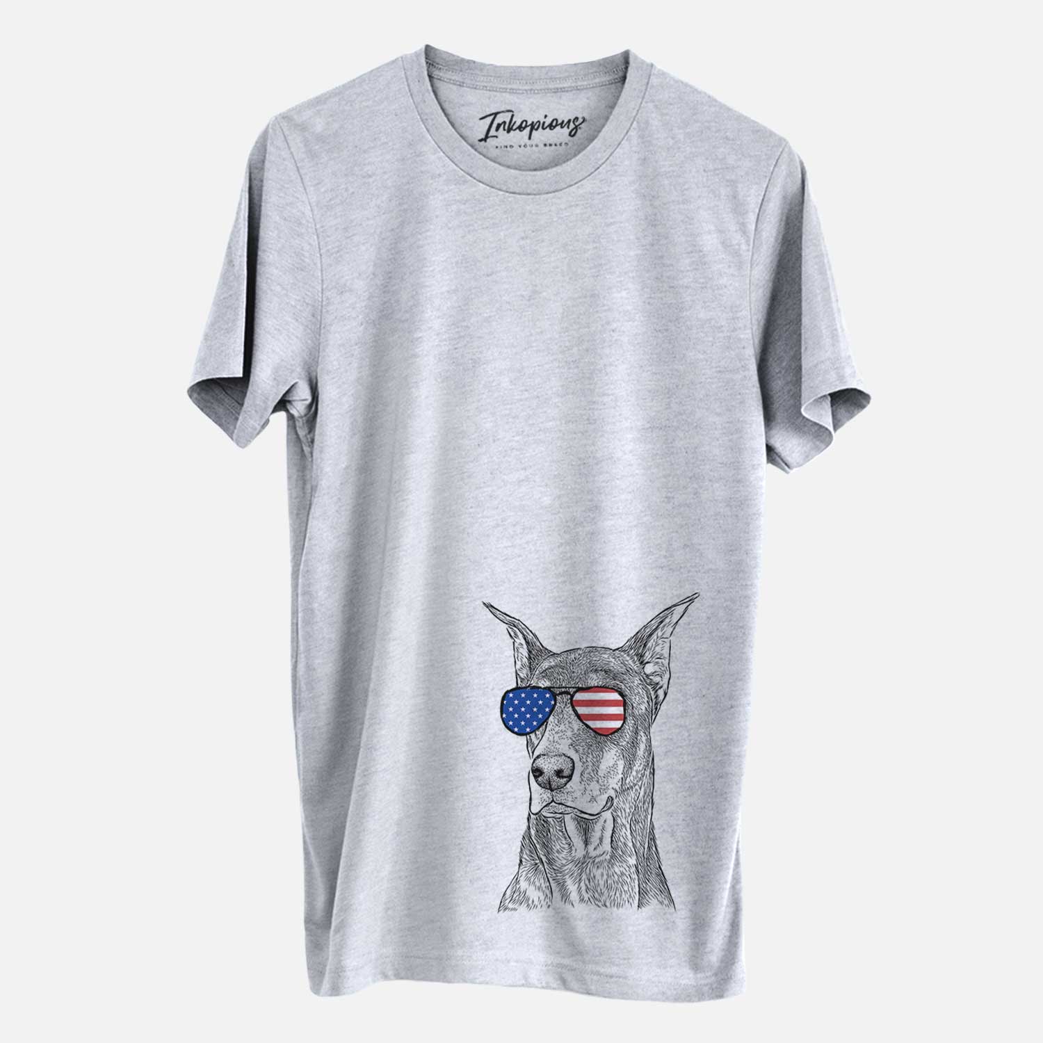 Hand-drawn sketch of RJ the Doberman Pinscher wearing American flag sunglasses on a Grey Unisex crewneck