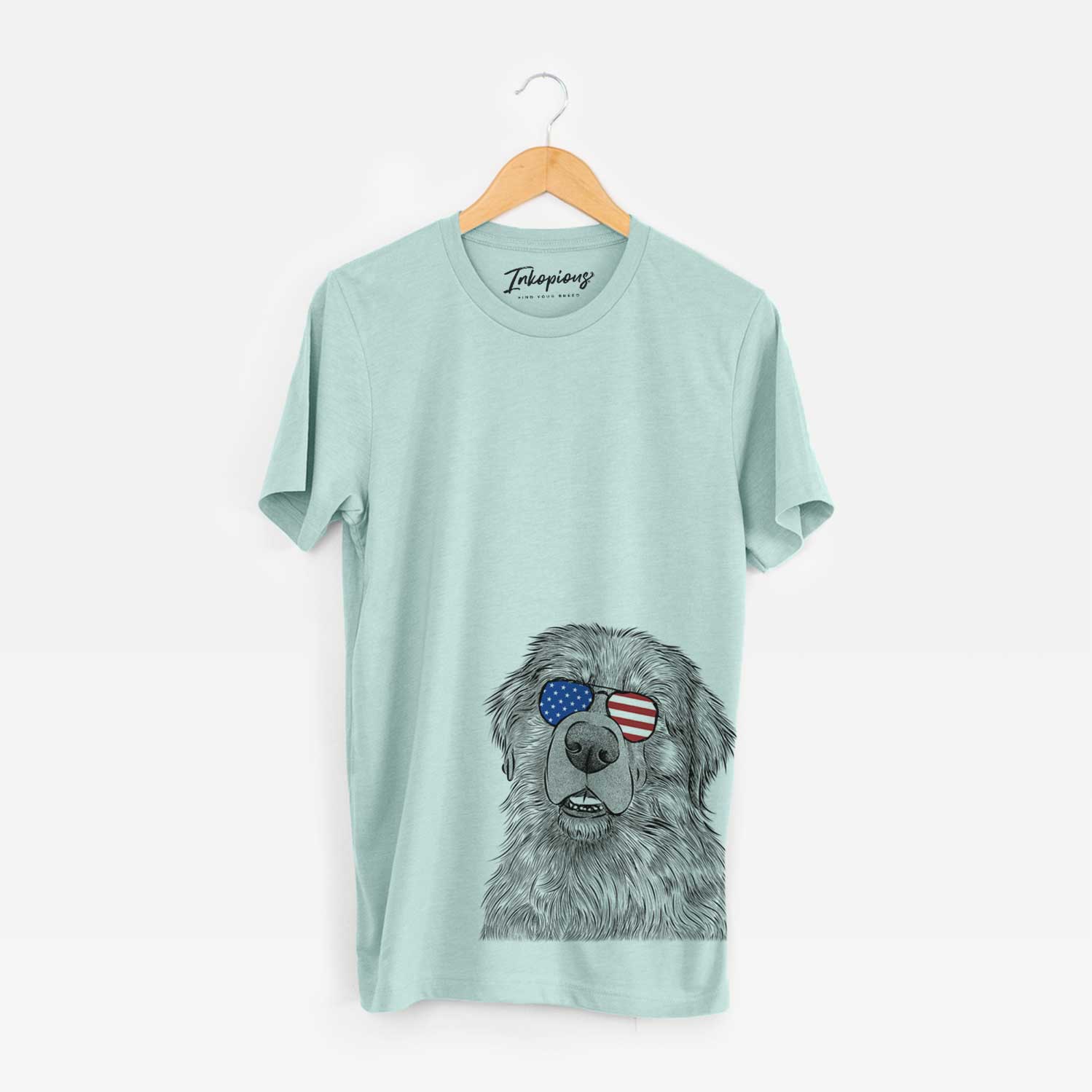 Hand-drawn sketch of Ralph the Leonberger wearing American flag sunglasses on a Heather Sage Unisex crewneck