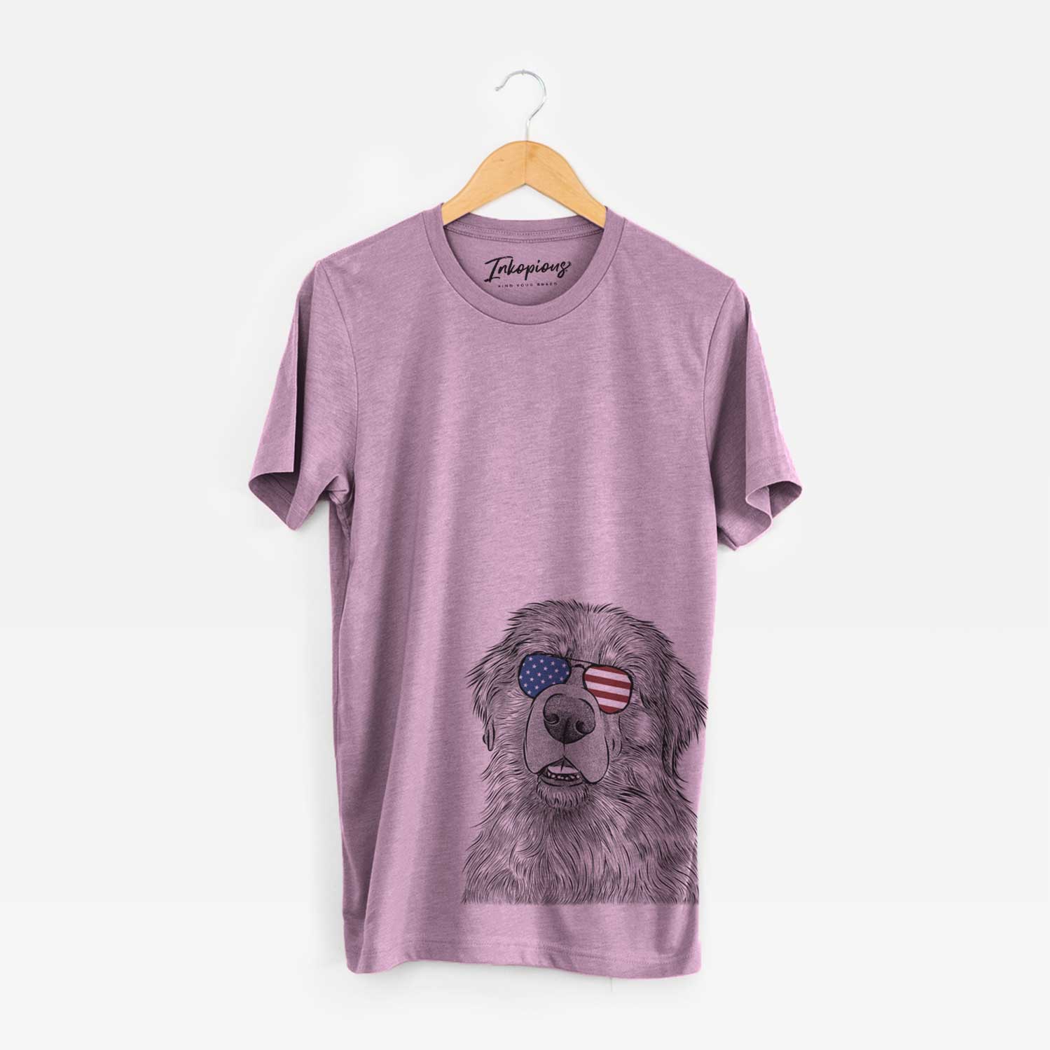 Hand-drawn sketch of Ralph the Leonberger wearing American flag sunglasses on an Orchid Unisex crewneck