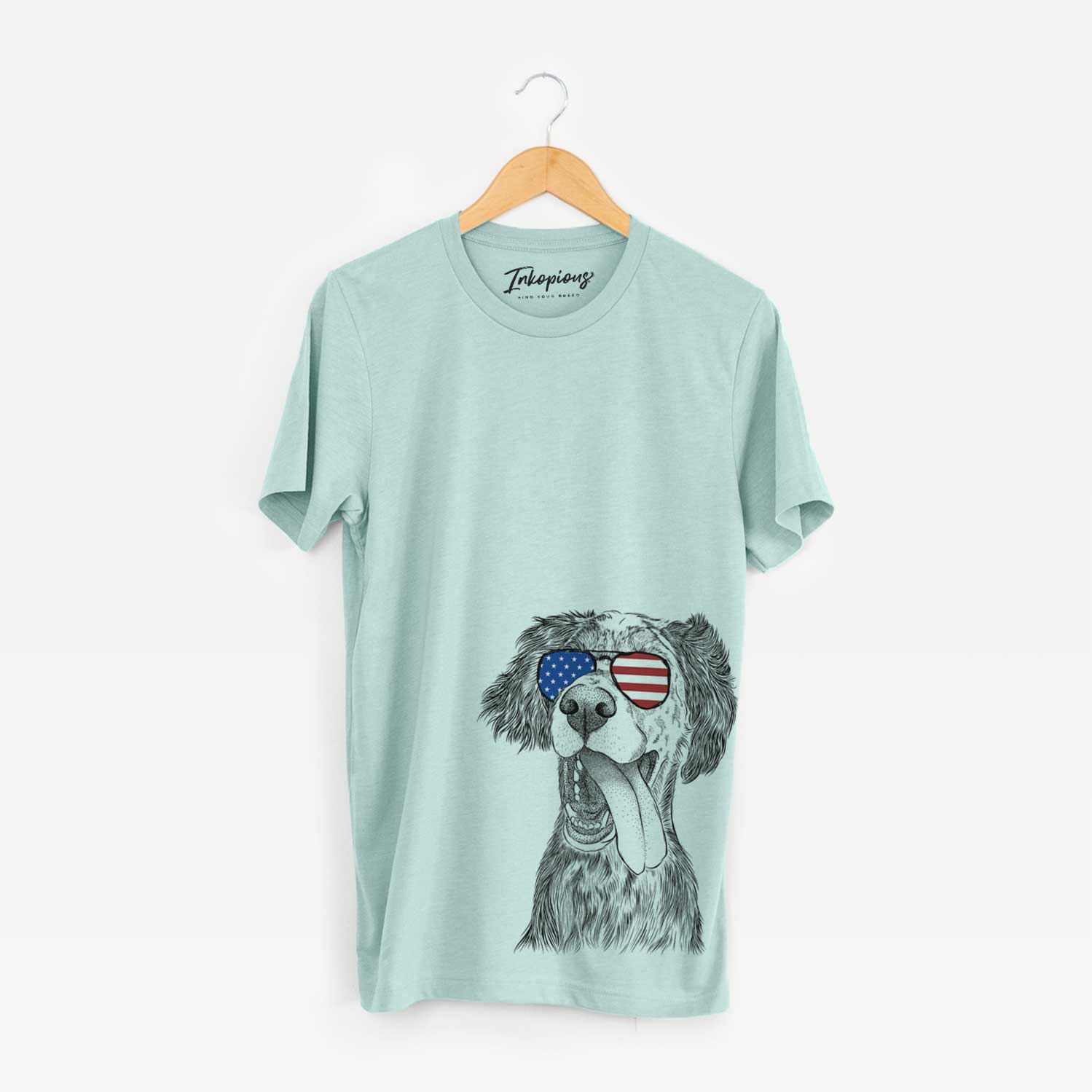 Hand-drawn sketch of Renly the English Setter wearing American flag sunglasses on a Heather Sage Unisex crewneck