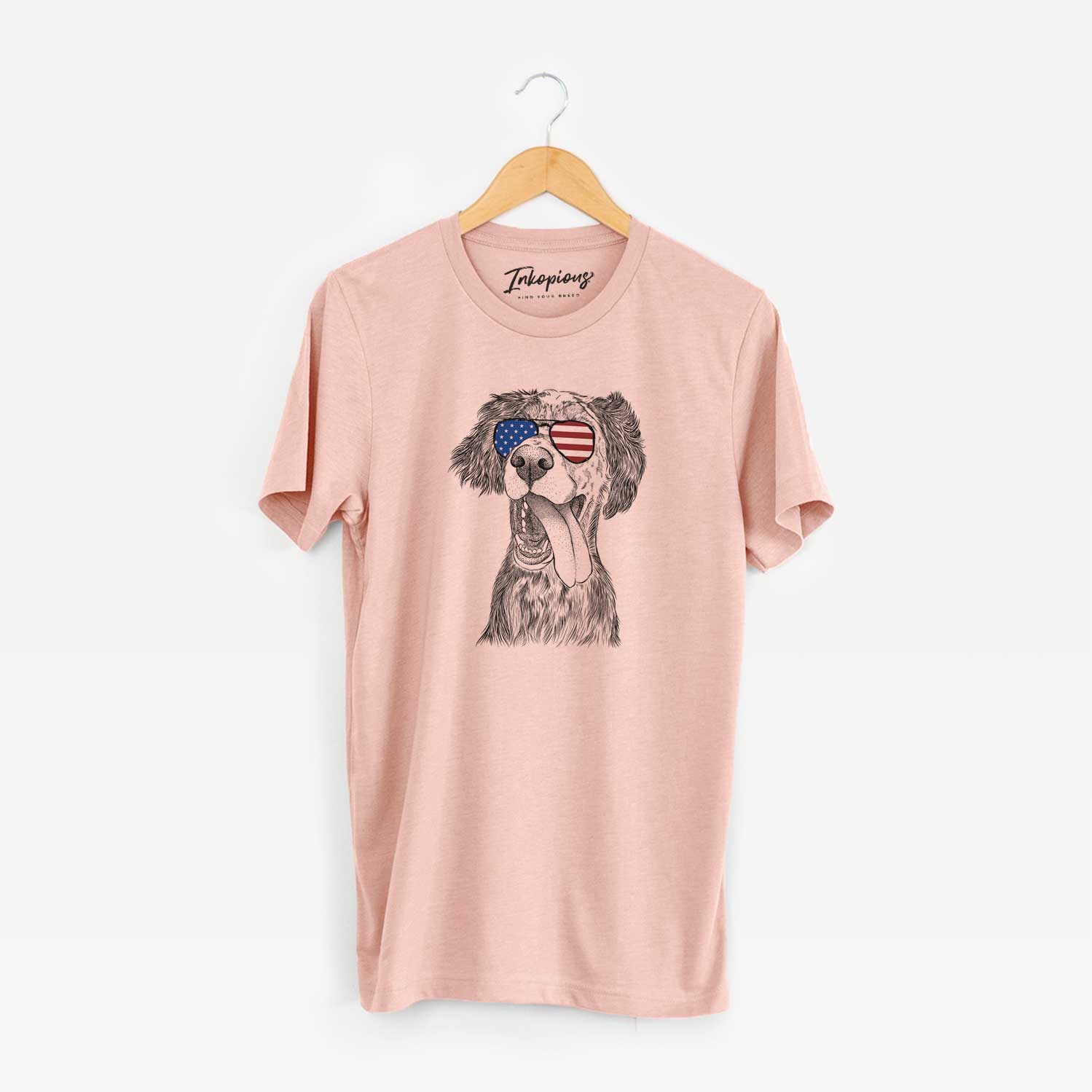 Hand-drawn sketch of Renly the English Setter wearing American flag sunglasses on a Peach Unisex crewneck