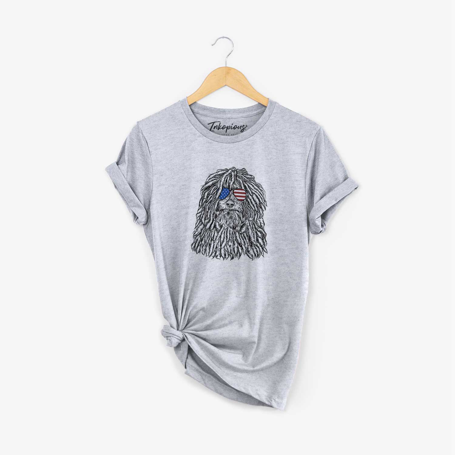 Hand-drawn sketch of Rezi the Puli wearing American flag sunglasses on a Grey Unisex crewneck