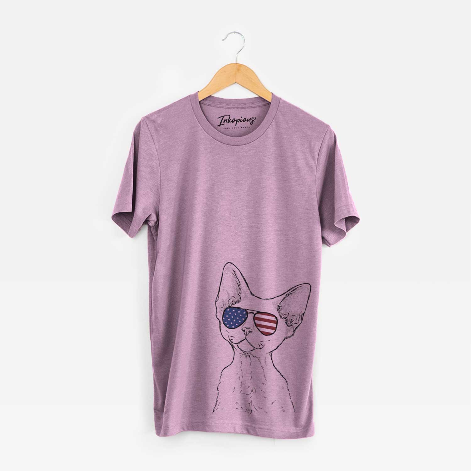 Hand-drawn sketch of Ripley the Devon Rex Cat wearing American flag sunglasses on an Orchid Unisex crewneck