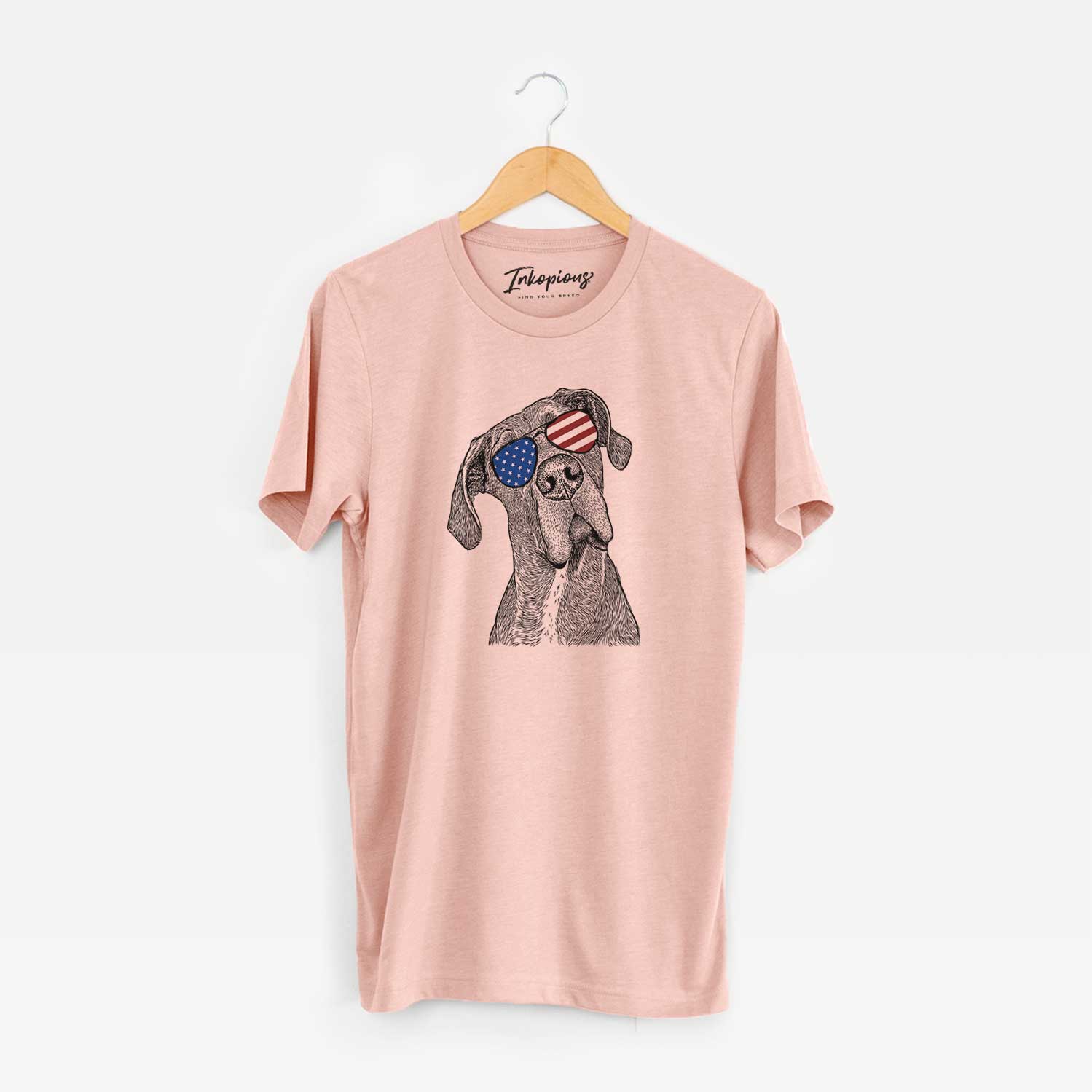 Hand-drawn sketch of River the Great Dane wearing American flag sunglasses on a Peach Unisex crewneck