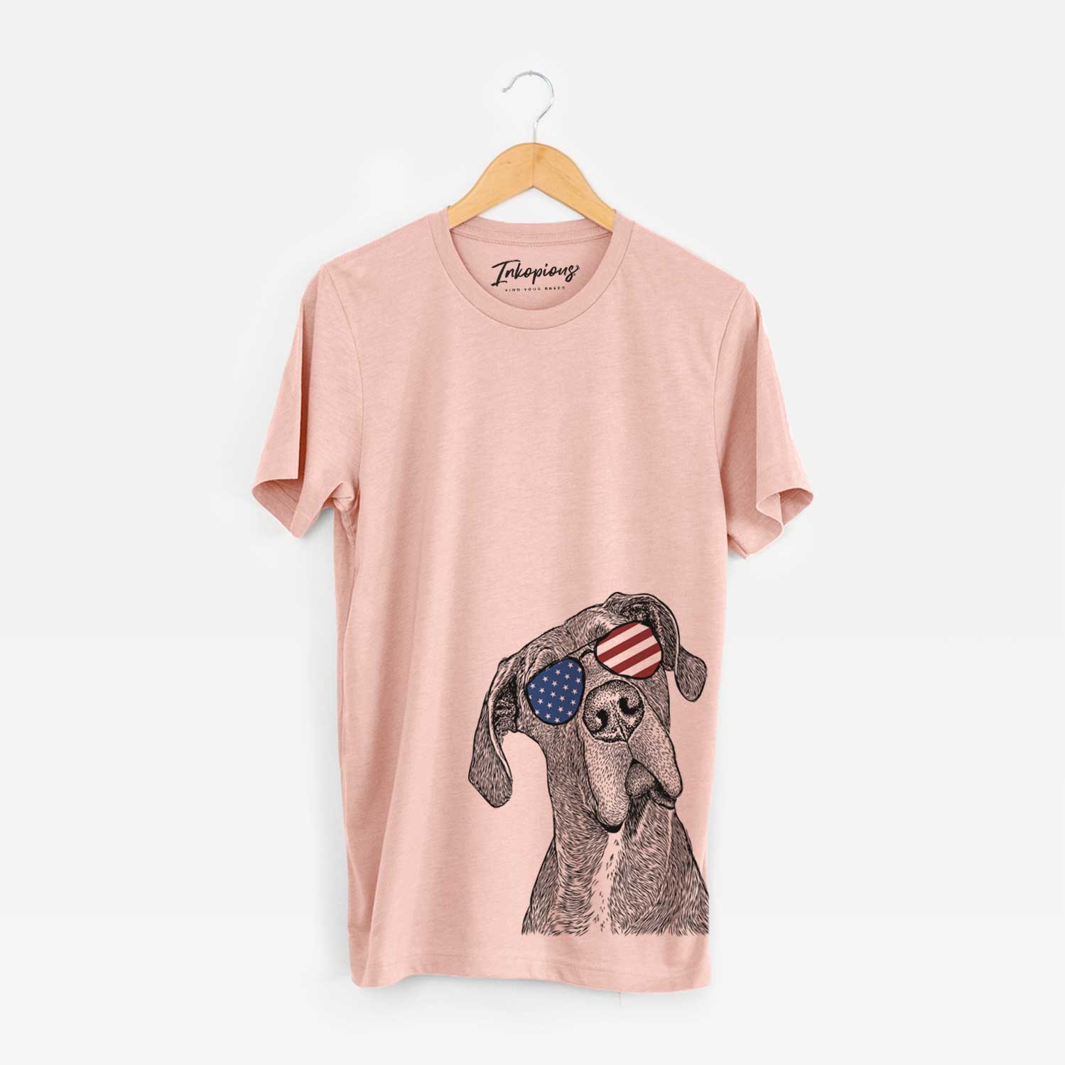 Hand-drawn sketch of River the Great Dane wearing American flag sunglasses on a Peach Unisex crewneck