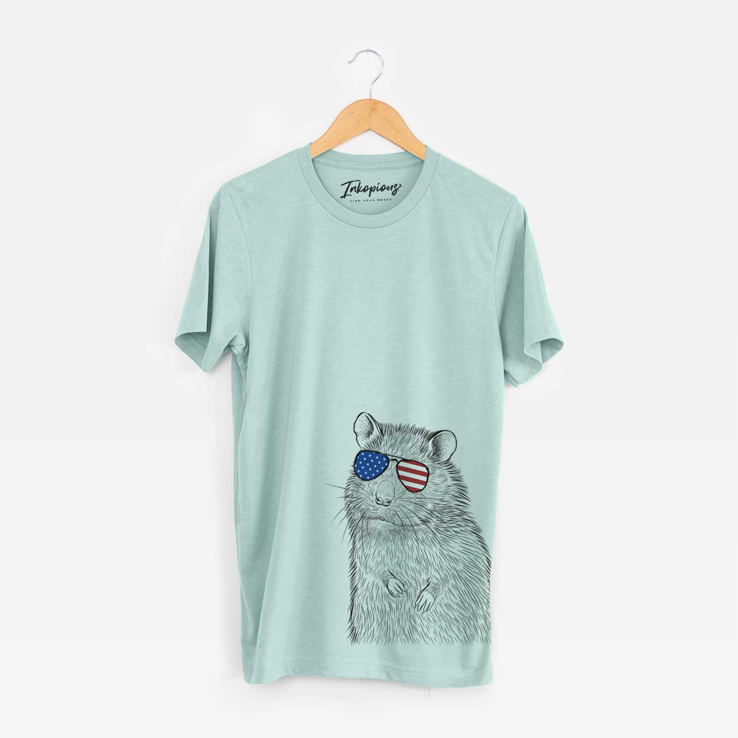 Hand-drawn sketch of Rizzo the Rat wearing American flag sunglasses on a Heather Sage Unisex crewneck