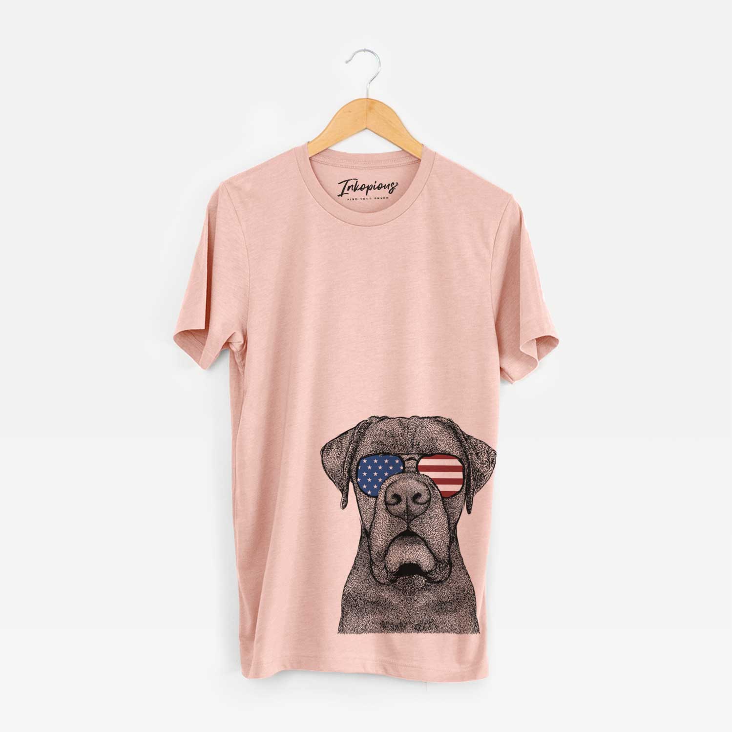Hand-drawn sketch of Rocco the Cane Corso wearing American flag sunglasses on a Peach Unisex crewneck
