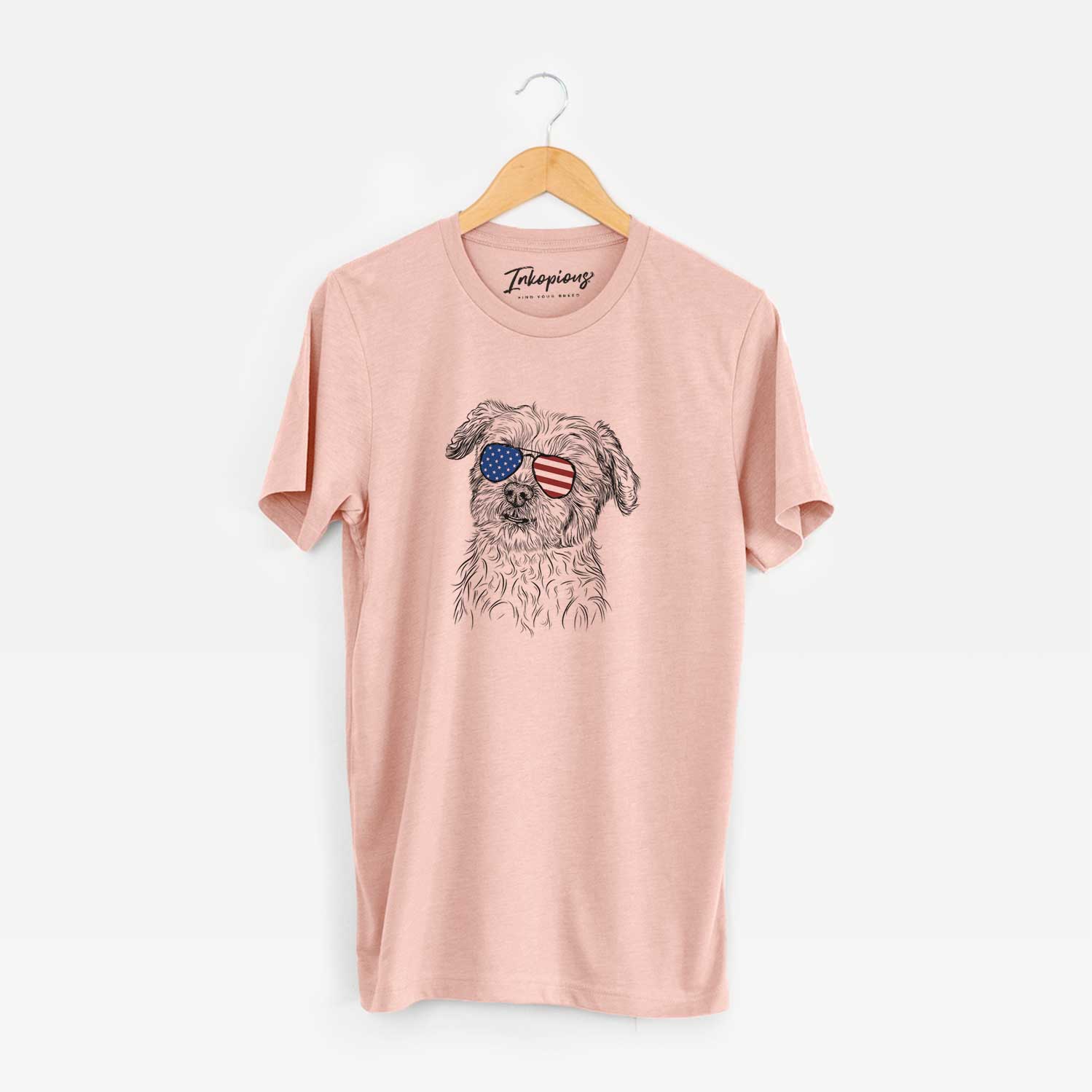 Hand-drawn sketch of Roxie the Schnauzer Shih Tzu Mix wearing American flag sunglasses on a Peach Unisex crewneck