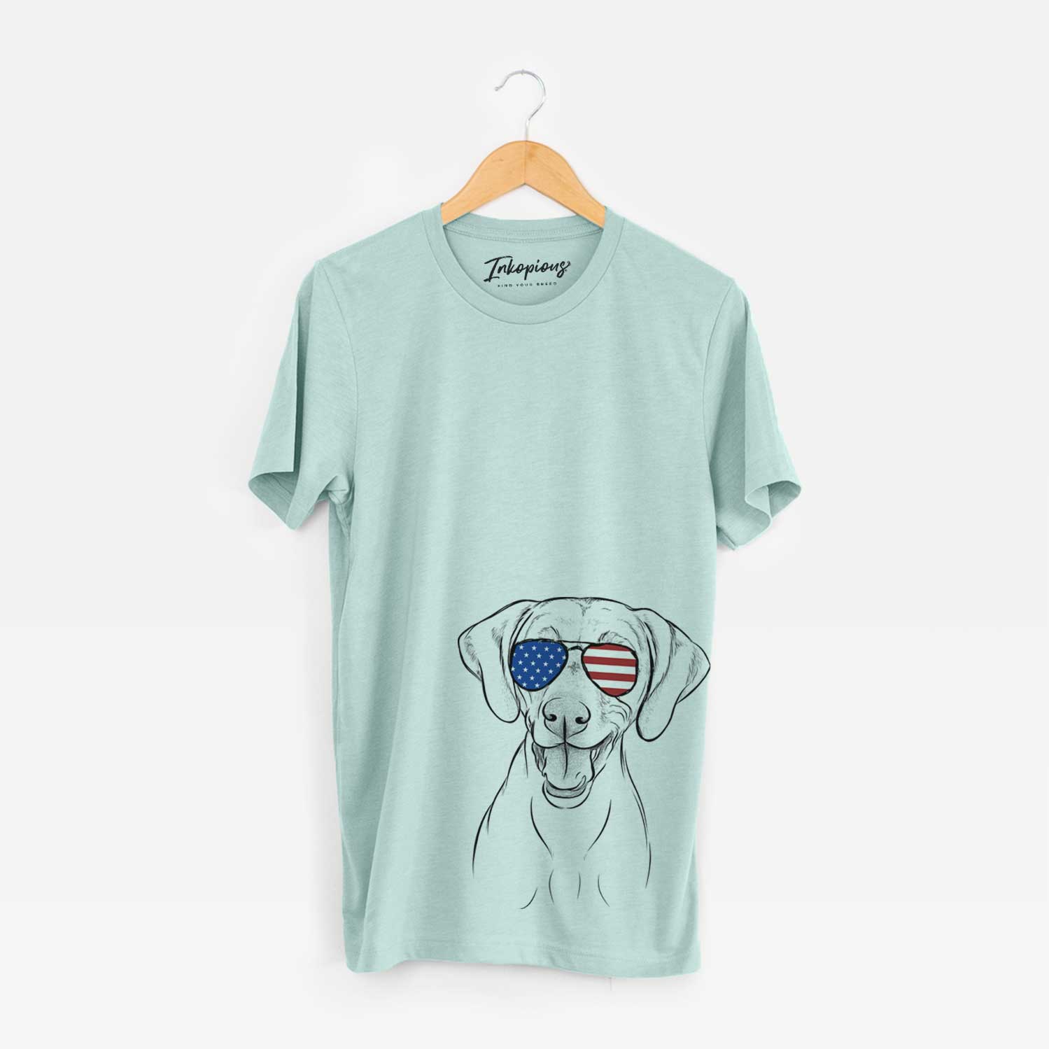 Hand-drawn sketch of Ruby the Vizsla wearing American flag sunglasses on a Heather Sage Unisex crewneck