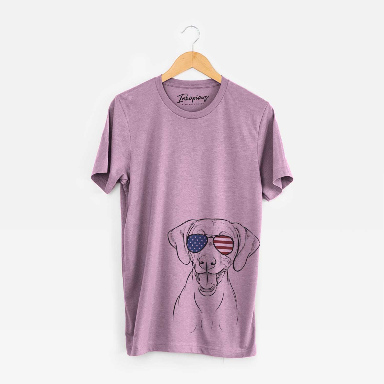 Hand-drawn sketch of Ruby the Vizsla wearing American flag sunglasses on an Orchid Unisex crewneck