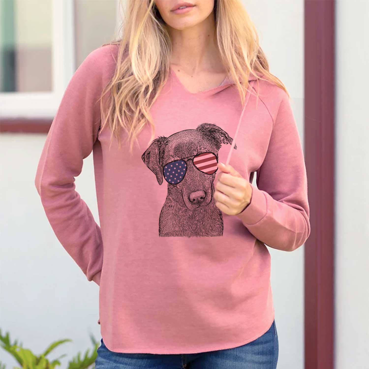 Hand-drawn sketch of Sadie the Whipador wearing American flag sunglasses on a Dusty Rose Cali Wave Hooded Sweatshirt, lifestyle photo