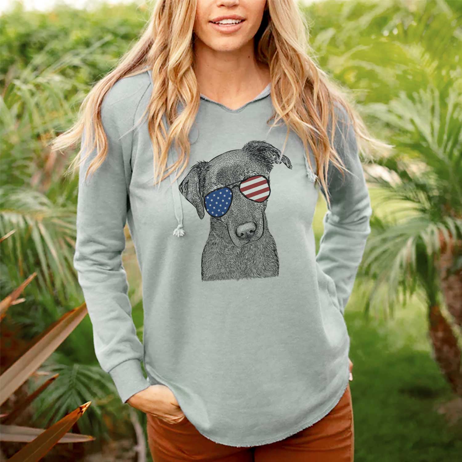 Hand-drawn sketch of Sadie the Whipador wearing American flag sunglasses on a Sage Cali Wave Hooded Sweatshirt, lifestyle photo