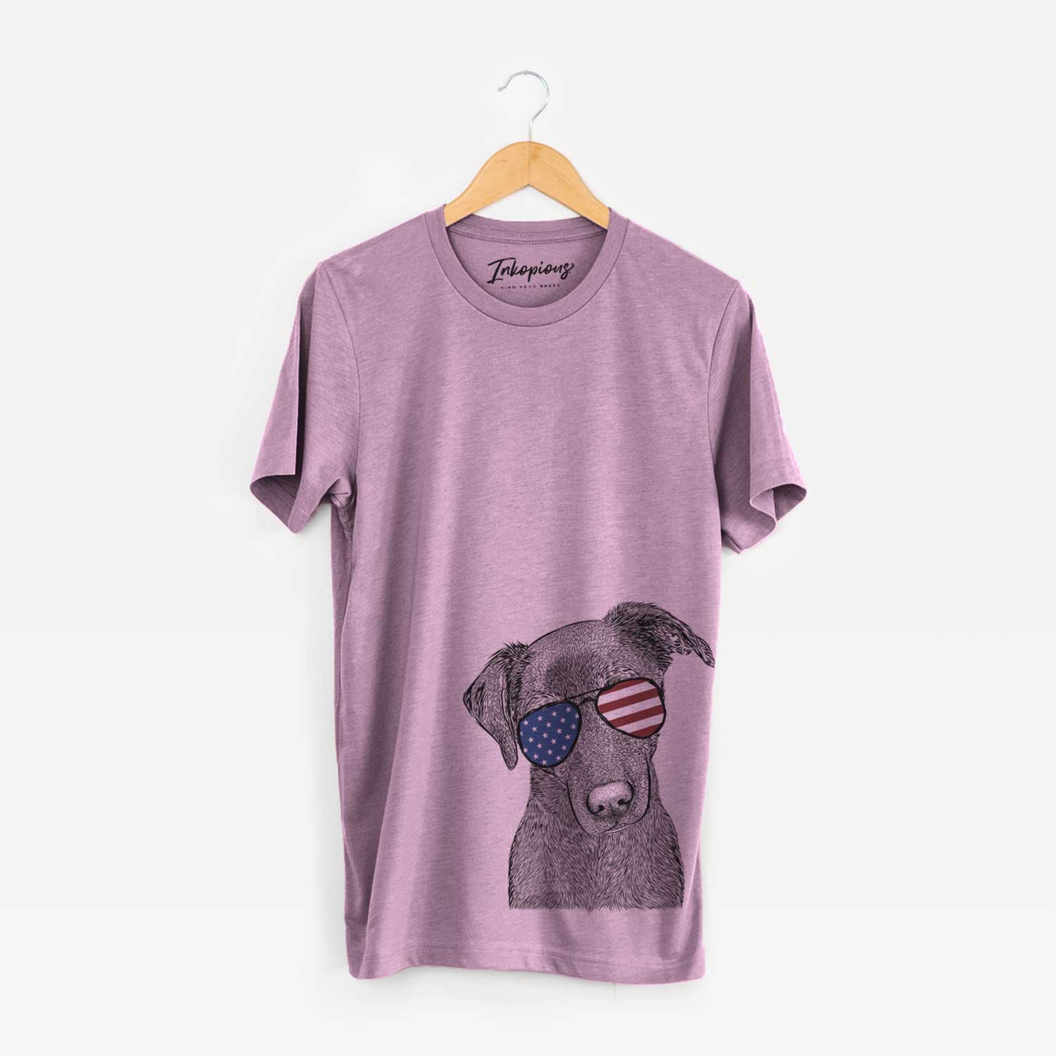Hand-drawn sketch of Sadie the Whipador wearing American flag sunglasses on an Orchid Unisex crewneck