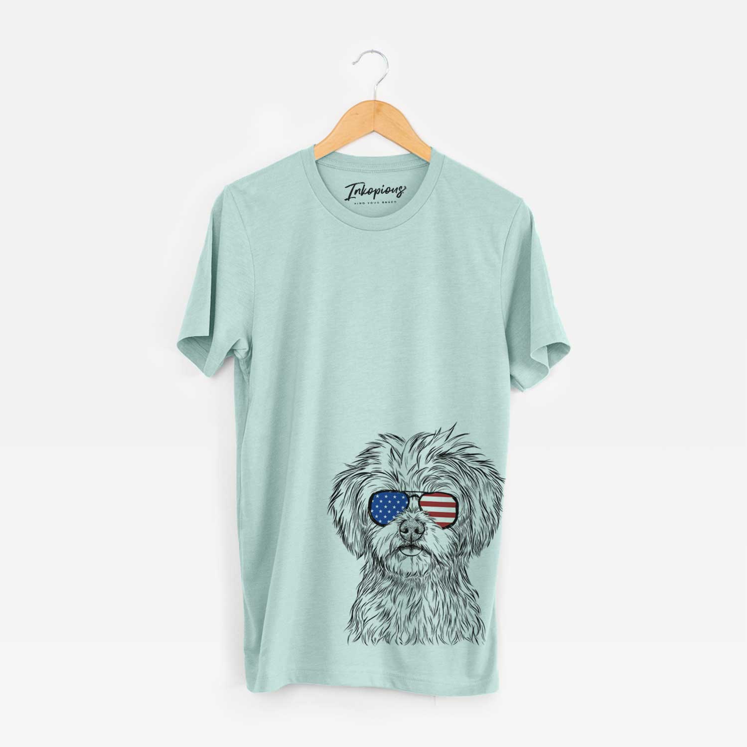 Hand-drawn sketch of Sammy the Shorkie wearing American flag sunglasses on a Heather Sage Unisex crewneck