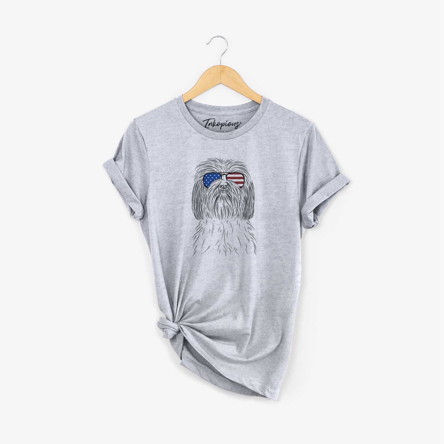 Hand-drawn sketch of Scully the Shih Tzu wearing American flag sunglasses on a Grey Unisex crewneck