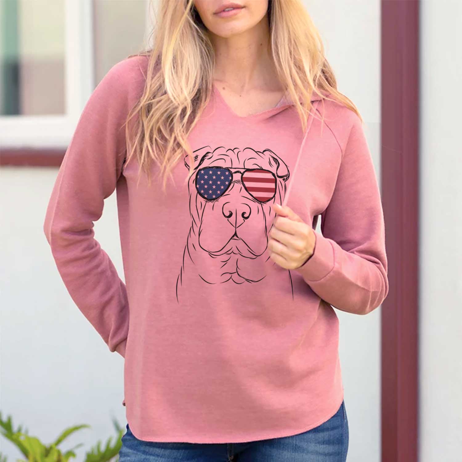 Hand-drawn sketch of Sharpy the Shar Pei wearing American flag sunglasses on a Dusty Rose Cali Wave Hooded Sweatshirt, lifestyle photo