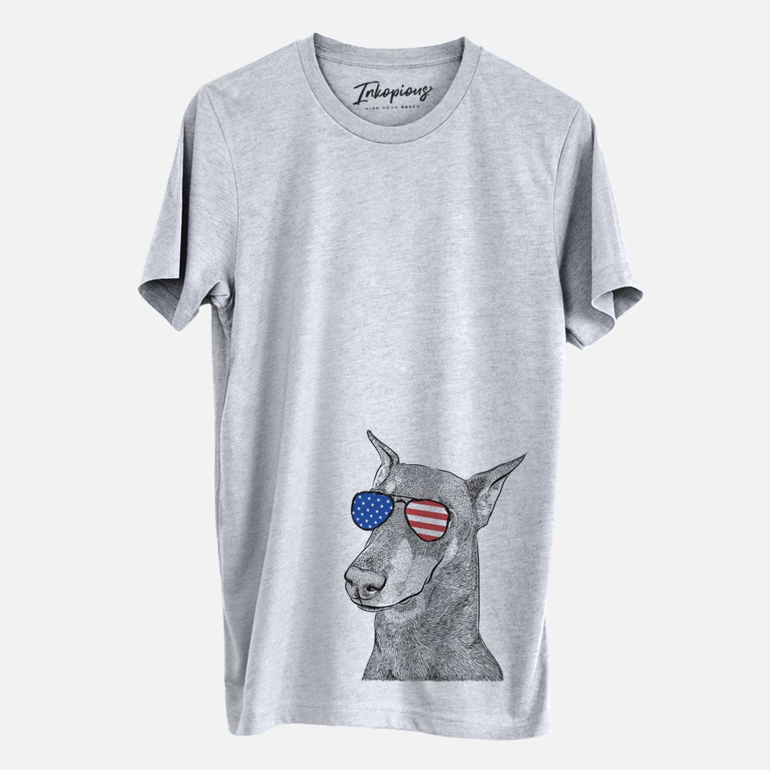 Hand-drawn sketch of Shelby the Doberman Pinscher wearing American flag sunglasses on a Grey Unisex crewneck