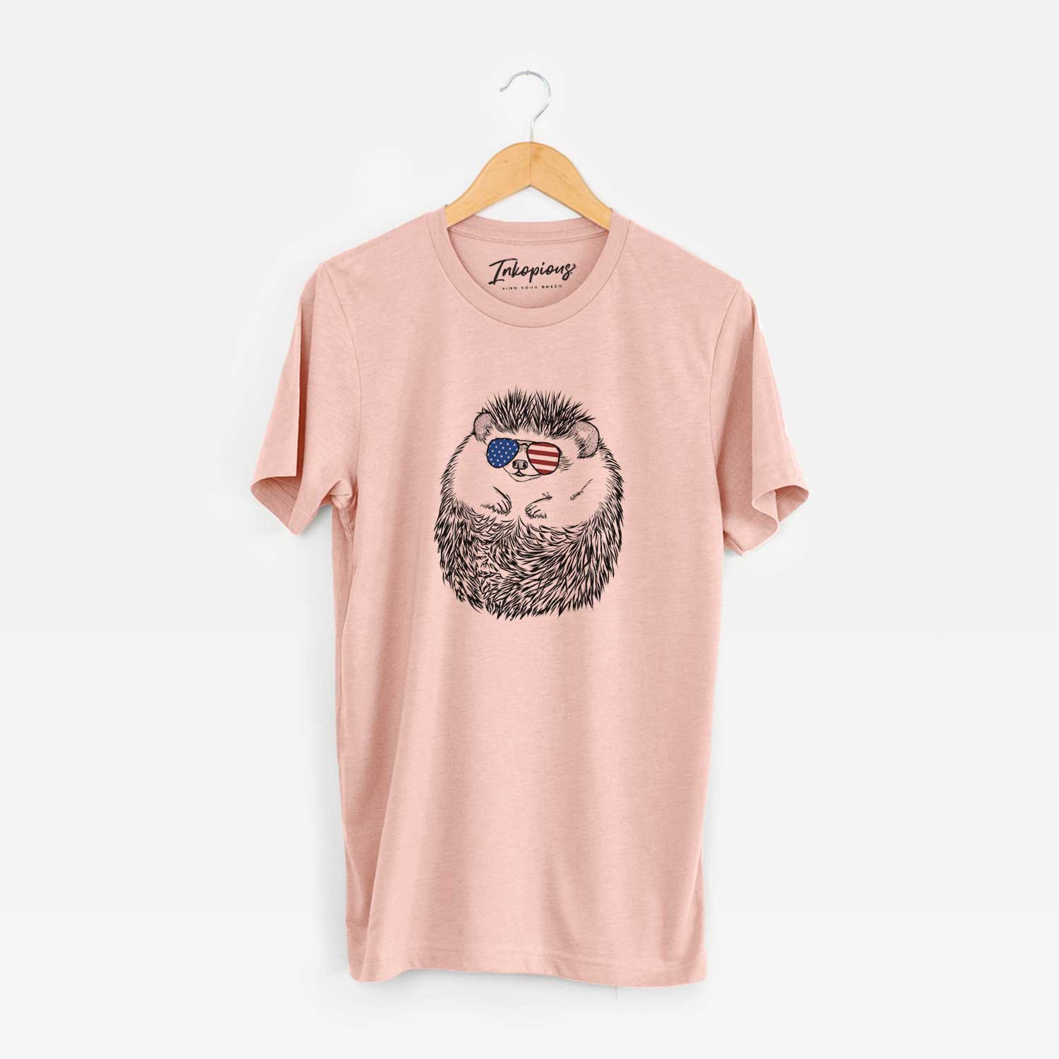 Hand-drawn sketch of Sid the Hedgehog wearing American flag sunglasses on a Peach Unisex crewneck