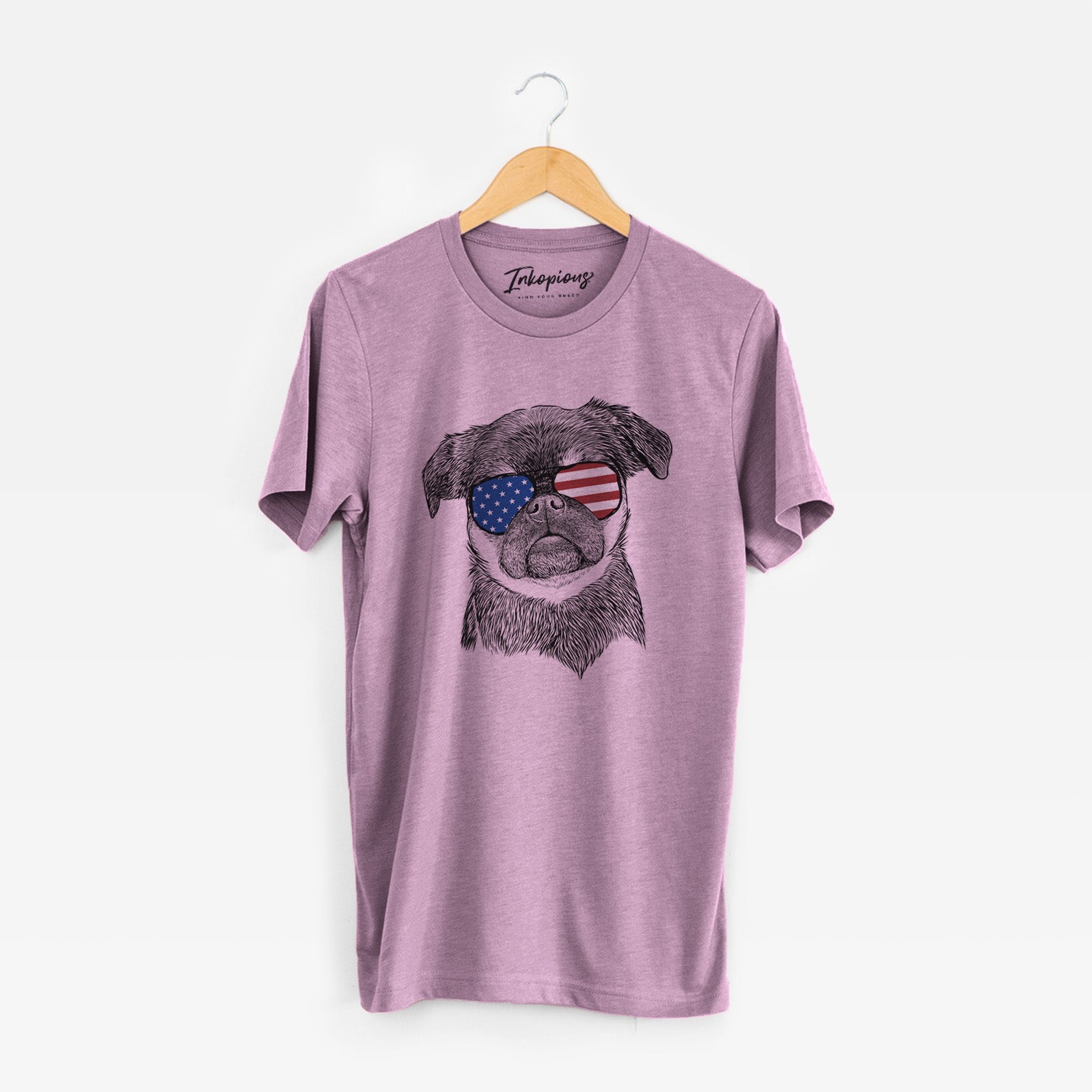 Hand-drawn sketch of Simone the Brussels Griffon wearing American flag sunglasses on an Orchid Unisex crewneck