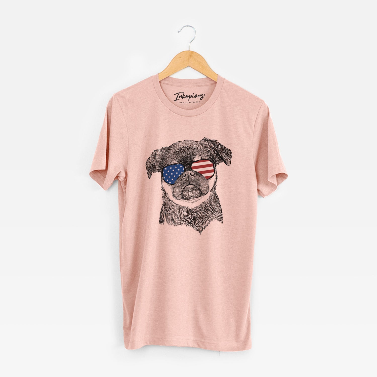 Hand-drawn sketch of Simone the Brussels Griffon wearing American flag sunglasses on a Peach Unisex crewneck