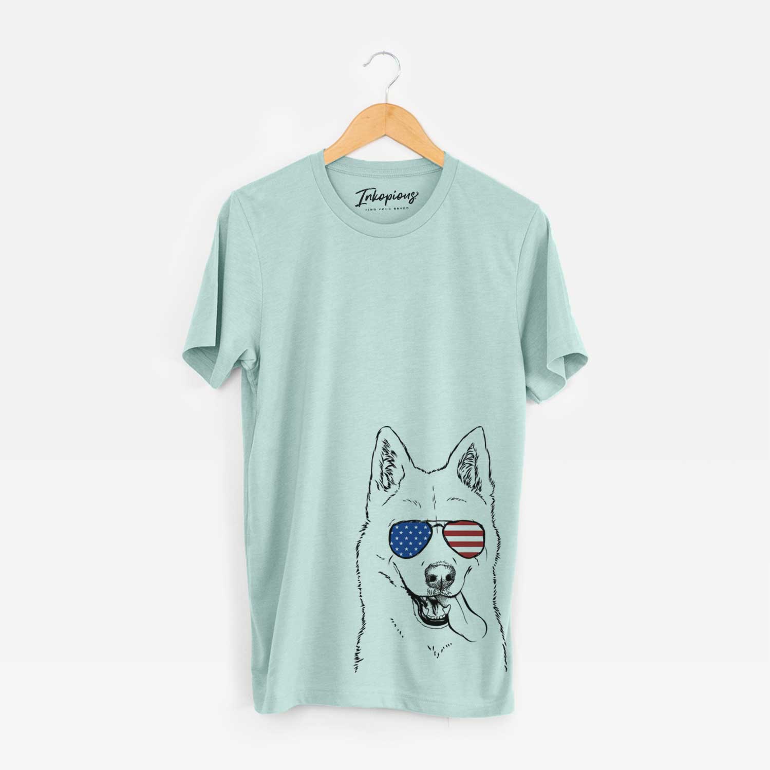 Hand-drawn sketch of Sinatra the Siberian Husky wearing American flag sunglasses on a Heather Sage Unisex crewneck
