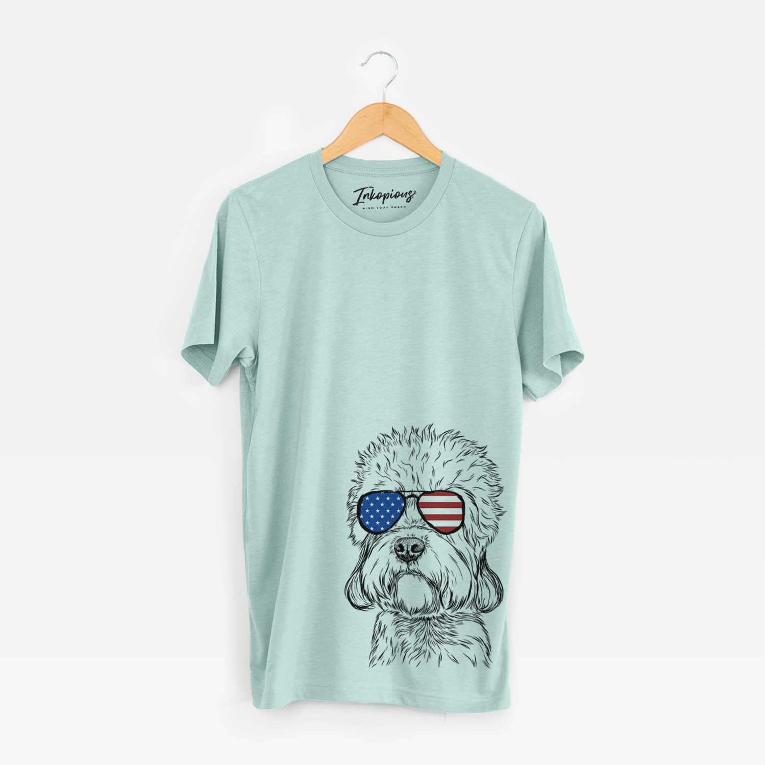 Hand-drawn sketch of Sir Walter the Dandie Dinmont Terrier wearing American flag sunglasses on a Heather Sage Unisex crewneck