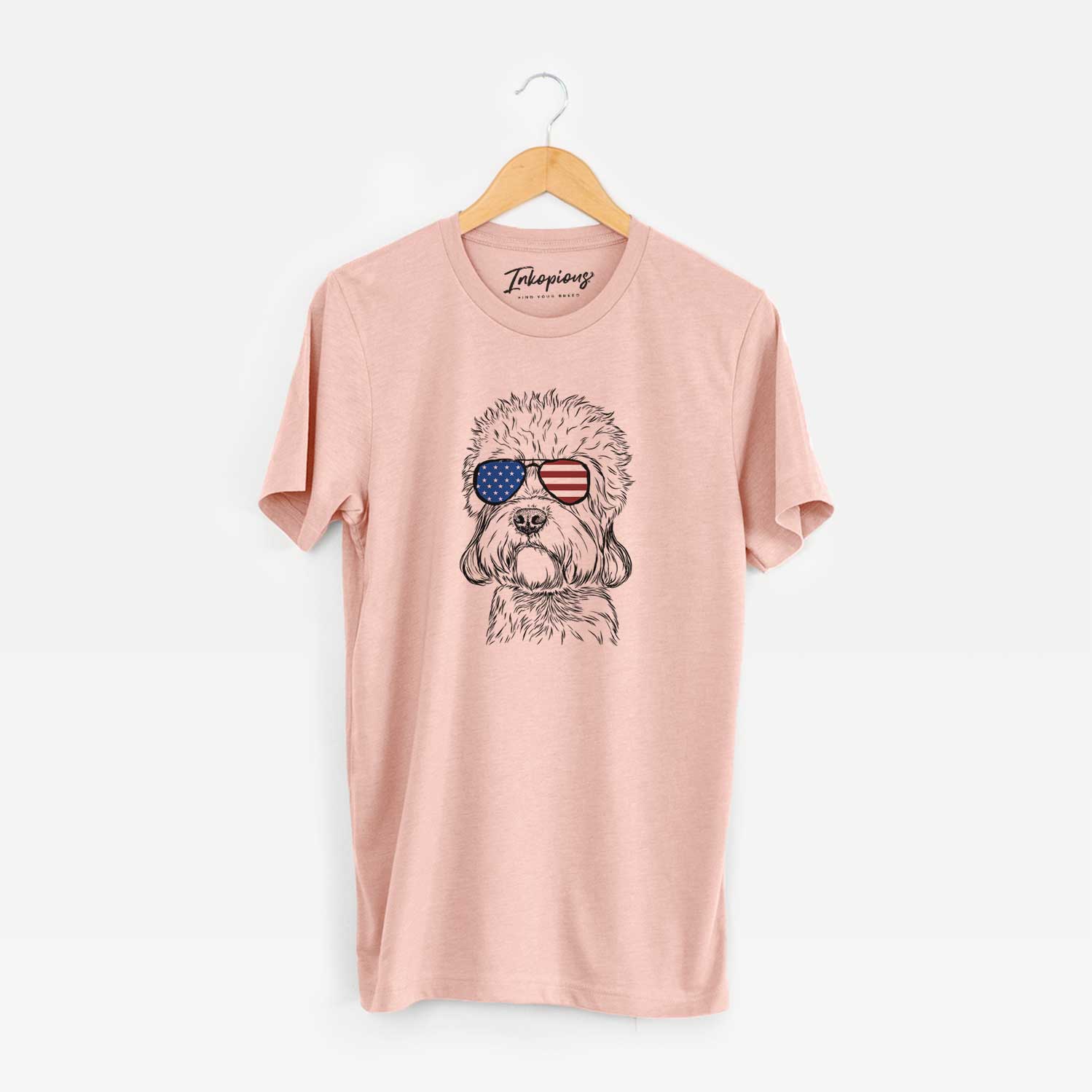 Hand-drawn sketch of Sir Walter the Dandie Dinmont Terrier wearing American flag sunglasses on a Peach Unisex crewneck