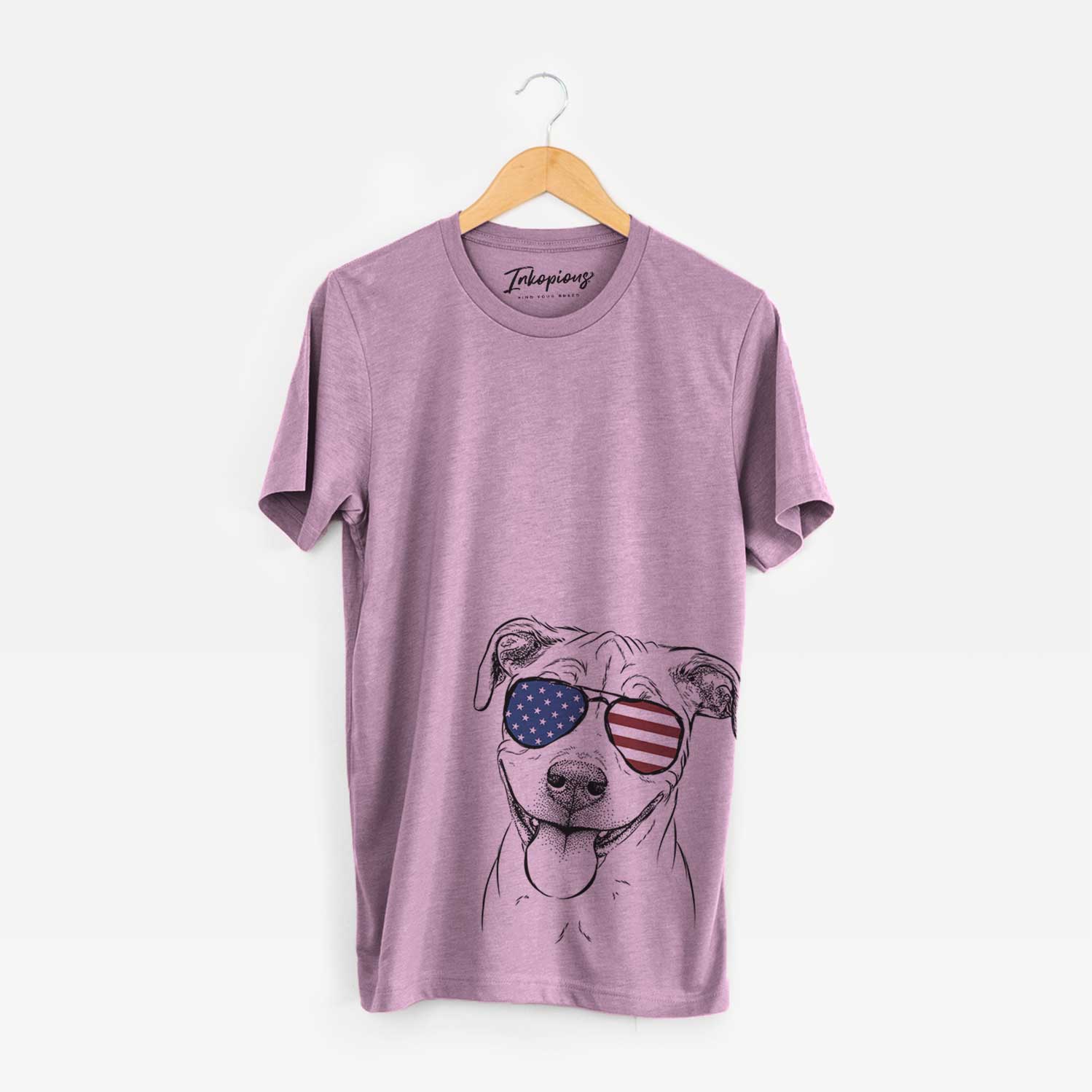 Hand-drawn sketch of Skye the Pitweiler wearing American flag sunglasses on an Orchid Unisex crewneck