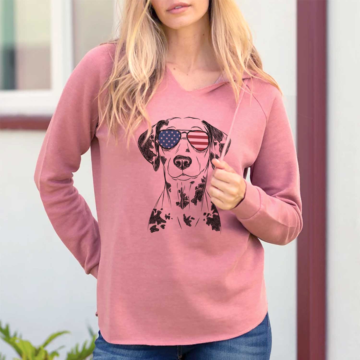 Hand-drawn sketch of Spot the Dalmatian wearing American flag sunglasses on a Dusty Rose Cali Wave Hooded Sweatshirt, lifestyle photo
